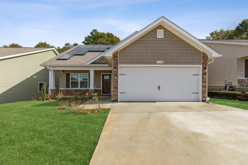 This beautiful 2 story home is located in Central Crestview. This home offers an open floor concept which consists of a large living room and kitchen combined. Both of these rooms have chestnut laminate flooring. The kitchen has ivory cabinets and a bar top and stainless steel appliances. The master bedroom is downstairs for added privacy. The master bathroom has a walk in closet, double vanities, garden tub and a separate shower. The half bath is located downstairs and is perfect for guests. Upstairs you will find 3 additional bedrooms, a media room space and a spacious full bathroom. This home is equipped with solar panels. The French doors lead to the back yard with a covered back porch and a privacy fence. Don't miss out on this beautiful home.