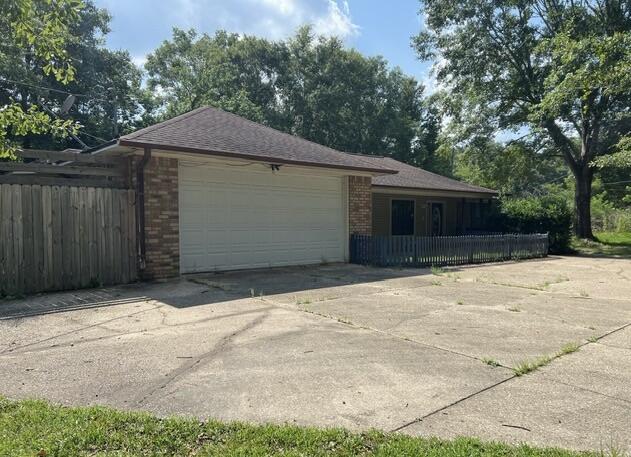 Built in 1991 and resting on approximately 1/2 acre, this 3 bedroom 2 bath REO home is one to see. Split bedroom design, this home has vaulted ceilings in the Great room, separate dining area, large kitchen, and fireplace in the living room. Enclosed room off the back of the home adds extra living space. Home has brick siding with some vinyl, partially fenced back yard and storage buildings outside. Close to NWFL, shopping, and churches, this home has tons of potential. Home is located on a private dirt road and due to condition only cash or rehab loans are accepted.
