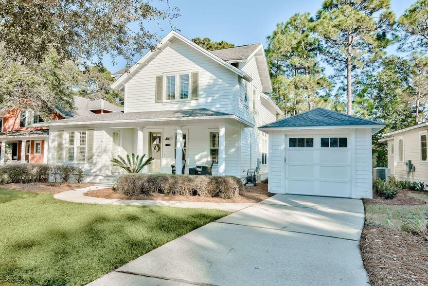 Situated on a spacious lot in a cul-de-sac, this lakefront home with detached garage is the epitome of a Florida coastal cottage. Daylight softly filters through multiple windows and the palette of coastal colors completes the restful ambience. The natural color scheme continues into the open-plan kitchen with granite counters, white cabinets, stainless appliances, and breakfast bar. The first-floor main bedroom provides views of nature and the lake as well as access to the back screened porch. There's ample parking with the detached garage and room for two cars in the driveway. The roomy front and back porches invite outdoor living and the opportunity to relax. One guest room is on the first floor while the second guest suite is upstairs. Sold furnished with small list of exclusions. Ideal as a second home, primary home, or investment rental property with a resort lifestyle. Located a short distance from the Laurel Grove community pool and fitness center strictly for use by Laurel Grove owners and guests. Head to the beach and endless recreational activities Sandestin offers including tennis, four golf courses, fishing, boating and watersports at Baytowne Wharf and Marina. Everyday amenities within a golf cart or bike ride include boutiques and a host of dining and community events at the charming Village of Baytowne, Grand Boulevard at Sandestin, and the Market Shops.