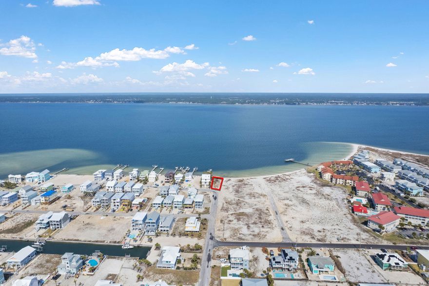 ***BUILD A FULL SIZE HOME ON A 60 FOOT WIDE DEEP WATER LOT*** LOCATED AT THE END OF THE STREET AND A SHORT WALK (OR GOLF CART RIDE) TO THE GULF BEACHES (ACROSS FROM THE PUBLIC BEACH ACCESS) Dream Waterfront Oasis Awaits on the Santa Rosa Sound!  Own a piece of paradise with this stunning waterfront lot directly on the Santa Rosa Sound on the island at sought-after Navarre Beach. This pristine .22-acre property boasts 62 feet of waterfront with a white sandy beach, offering unparalleled access to the tranquility and adventure of the Sound.  Boating enthusiasts rejoice! Deep water access allows you to easily dock your boat right at your own property, ready for exciting fishing trips or leisurely cruises.  Call today for more info!