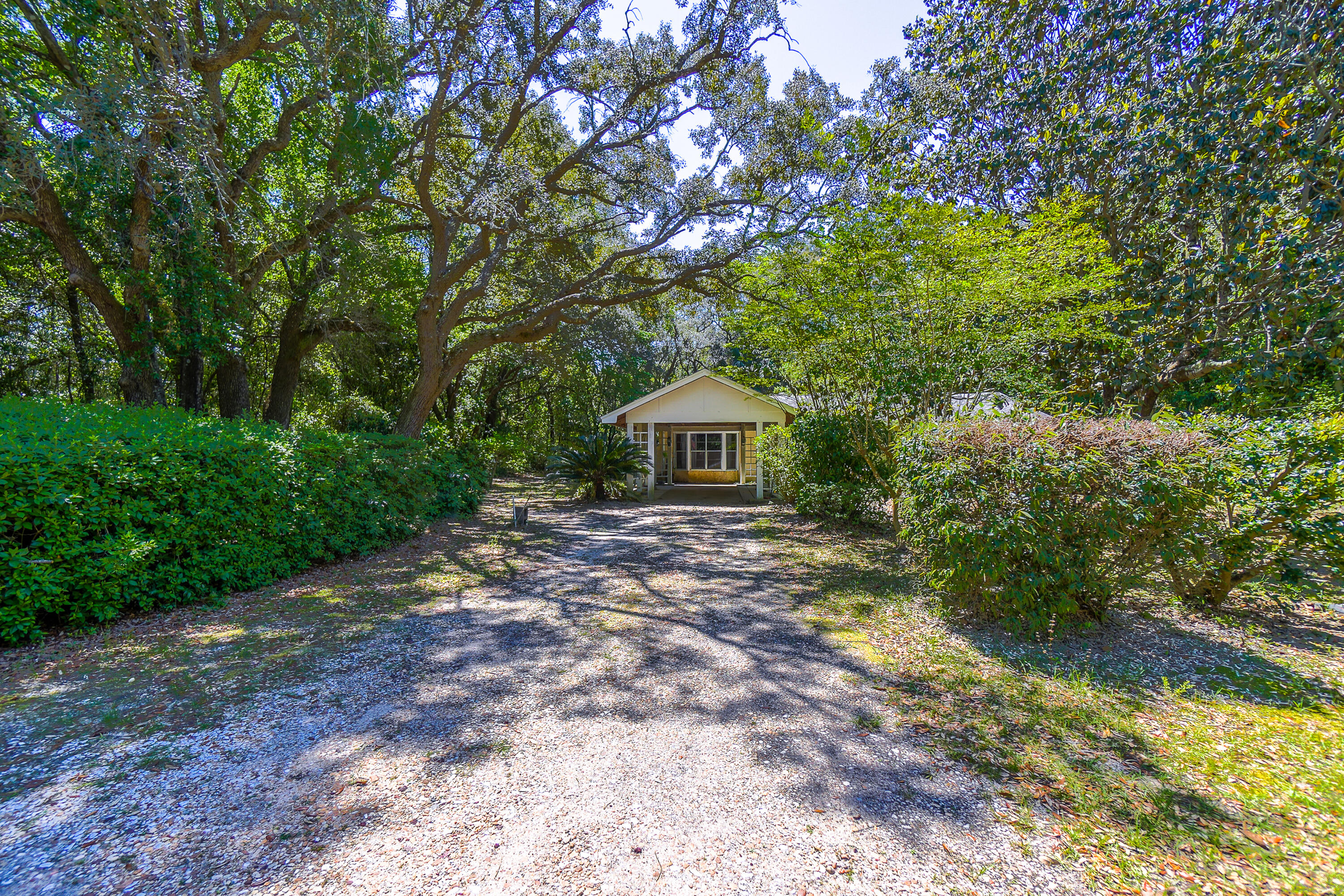 Welcome to highly desirable Weekley Bayou SD, where homes are rarely available.  This 3 bedroom 1.5 bath, one owner home, sits on just over a half acre lot saturated with gorgeous native palms and fruit producing trees.  Nestled between two wooded lots for extra privacy.  Large family room with beautiful custom built in shelving.  Extra large kitchen for entertaining adjacent to the 204 sf Florida Room for those quiet, cozy days.  Located 1.8 miles from Tarkiln Bayou State Park, boat launches and the worlds most beautiful sugar white beaches!  Private well for irrigation.  Roof replaced in 2018,  HVAC replaced in 2010 and a new drain field in 2015.  Don't miss this rare opportunity!  Schedule your private tour today!  BEING SOLD AS IS.