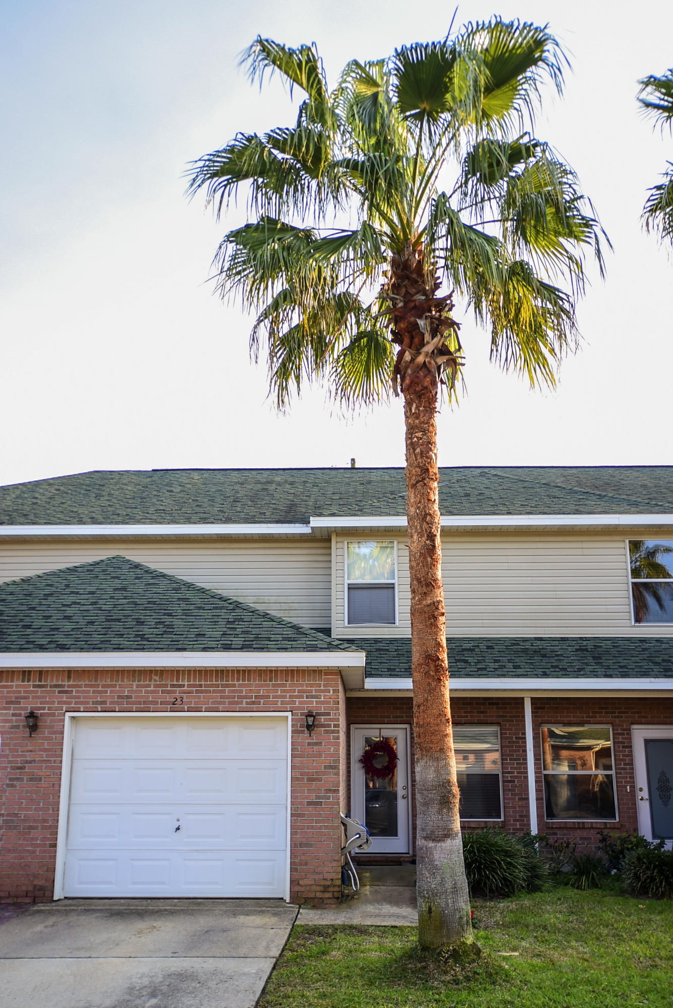 Get it while it's HOT! Just in time for spring and summer in Destin! This well maintained, move-in ready townhouse is your perfect place to call home! Enter this lovely unit and find soothing, neutral paint throughout (NEW!), a large living space that joins the spacious dining area and an open floor plan feel. The white kitchen features lots of counter space, brushed nickel knobs, painted cabinets, and painted granite-like counters. All kitchen appliances convey! The kitchen connects to the downstairs half bath and laundry room with w/d hookup and upper shelving. Below the stairs you'll find a large walk-in storage space. The dining area leads you outside through a sliding door w/screen to a covered patio. The quaint backyard is fully fenced, features NEW sod, a raised garden bed,