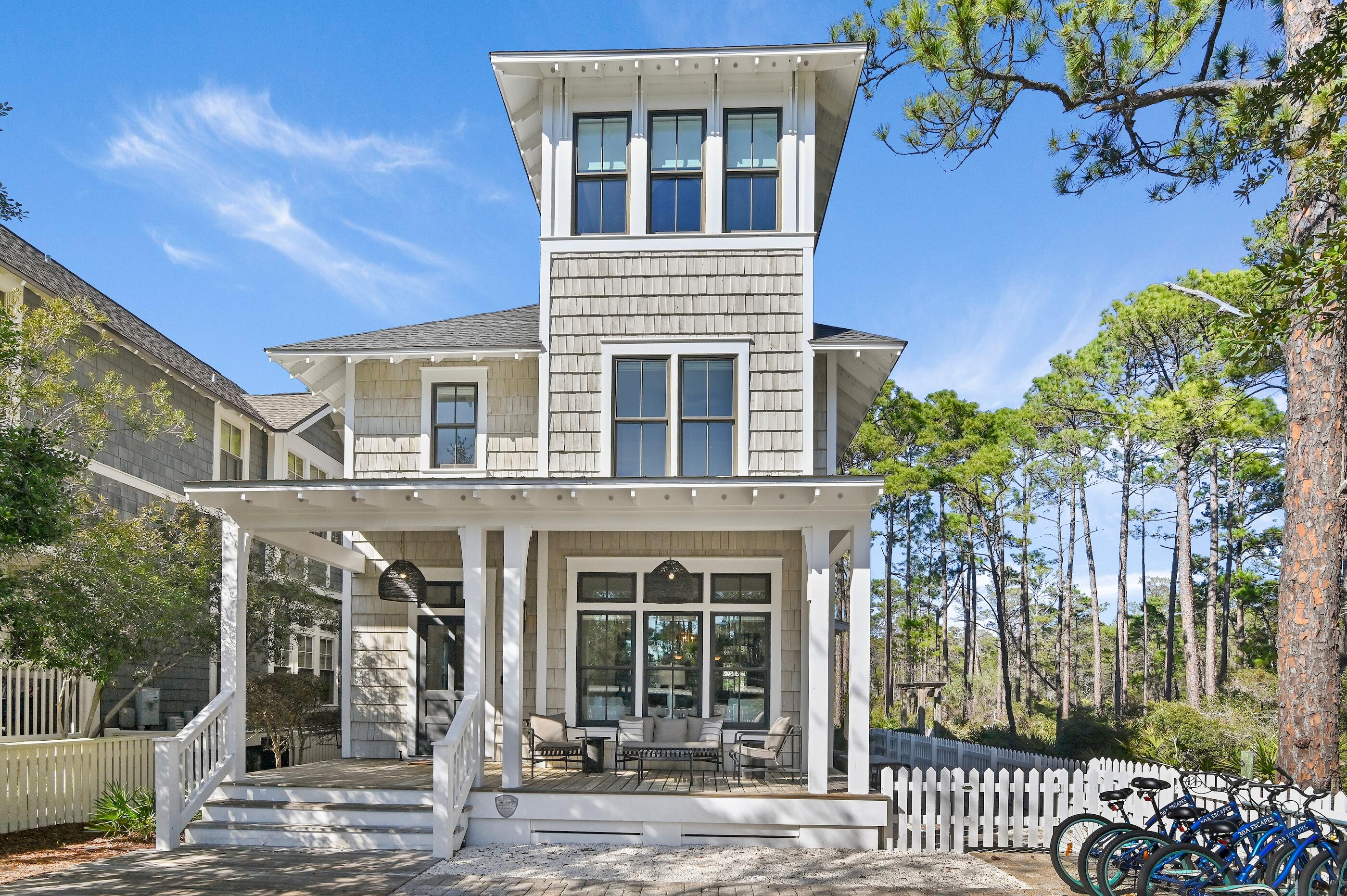 Discover the perfect blend of luxury and coastal living at this stunning home in the sought-after Watersound West Beach community. Nestled along the serene border of Deer Lake State Park, this residence offers a peaceful backdrop of natural beauty adjacent to scenic walking trails leading to the beach.Just steps from the community pool and the beach boardwalk, enjoy effortless access to sugar-white sands and the turquoise waters of the Gulf with no crowds! The open-concept design features spacious living areas, ideal for entertaining or relaxing after a day at the beach. Custom features include true wide planked hardwood flooring, luxury appliances, hand-selected fixtures, as well as extensive wainscoting and wood trim work throughout. Offered fully furnished, this well thought out floor plan showcases an open concept living space on the main level with expansive state park views, a spacious master suite, 2 guest bedrooms suites, a private bunk room plus another bunk space tucked under the stairs, and a third floor den with gulf views that can double as a 4th bedroom. Plenty of storage can be found throughout the home and there is a home office on the main level. High end luxury finishes, generous porches, and serene outdoor spaces make this home an inviting coastal retreat. With exclusive access to Watersound West Beach amenities, including heated & cooled community pool, multiple parks, trails and boardwalks, manned security gate, fitness center, and private boardwalk to the BEACH with bike parking, this home offers the ultimate 30A lifestyle. Home is located on the most exclusive lot in the neighborhood, so don't miss your chance to own this piece of paradise perfectly positioned in a serene natural setting yet convenient to all 30A has to offer!