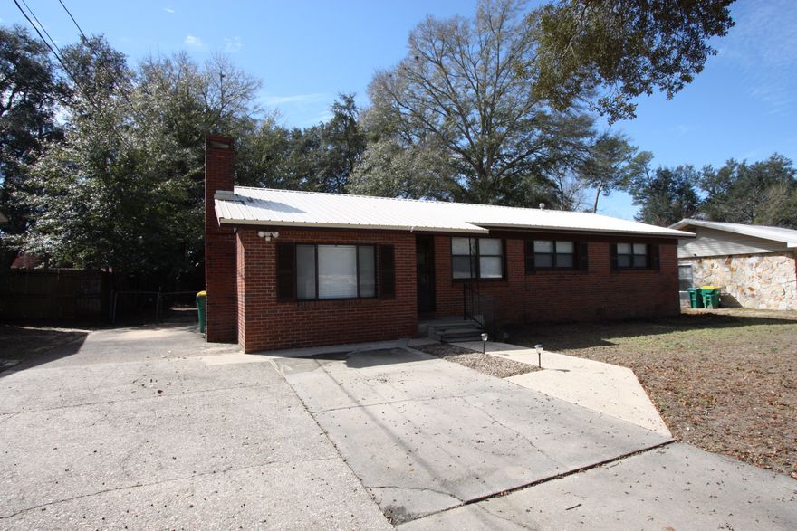 Well cared for 3 bedroom, 1.5 bath home on a large lot in the heart of Niceville is sure to catch your eye. This low maintenance, all brick home has a high efficiency a/c and a durable metal roof. The lovely interior is freshly painted and has original hardwood flooring. The kitchen is bright and cheery and has new blinds overlooking the large fenced back yard. Additional parking is available on the paved area on the side of the home and there is even room for a boat in the back yard. A large storage shed is located in the back yard. For the water lover, the home is located only a half mile from Lions Park.