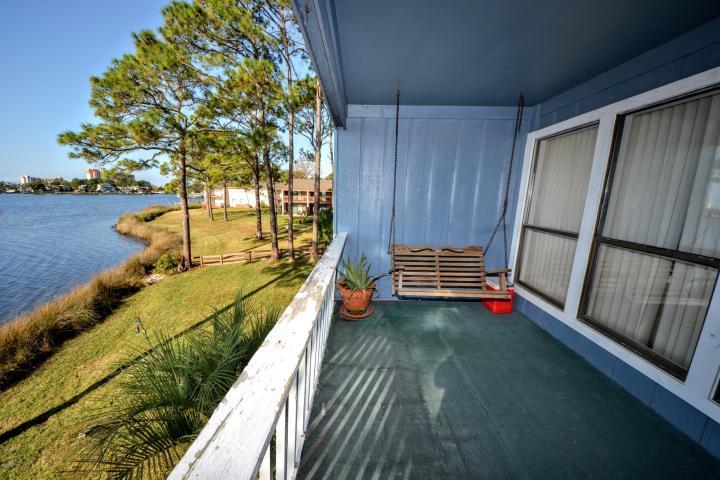 PRICE REDUCED! BRING ALL OFFERS!!! Great Gulf views from this custom built, partially furnished home near the beach. Gulf views from kitchen, living room & both upstairs bedrooms. Lots of high-end extras including bamboo flooring, 2 fireplaces, travertine tile, granite counters, screened pool, two balconies, 2 car garage and an elevator. This home is ready for you to add your personal touches and move in!! Buyer incentives with acceptable offer! Make your appointment to see this gem today!