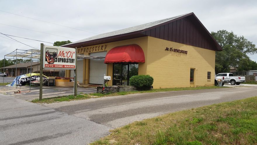 Great opportunity to own 56.55 feet along Highway 98 W. Great exposure with high traffic count daily.This 2000 square foot commercial building is ready for a new owner. 1280 square feet consist of shop area, which has two 12 foot roll up garage doors for easy access. 720 square foot of building currently is set up as office space.