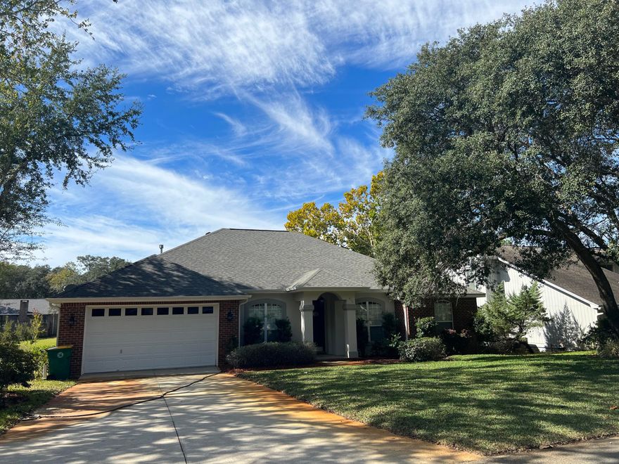 4 bedroom, 2 bath custom Bluewater Bay home overlooking the lake conveniently quick access to the Mid Bay bridge/Destin, shopping, Eglin AFB and A+ schools. Enjoy the breeze and water views from the large 316 sqft screened porch spanning the back length of the home. Interior hardwood plus 18'' tile flooring with carpeted bedrooms. The front door has a keypad/touch entry and the entrance hall opens to spacious family room with gas fireplace, vaulted-tray ceilings, crown molding and recessed lighting. The open plan great room borders an eat in kitchen with a breakfast bar and the large master bedroom features a walk-in closet and an adjoining master bathroom with double sink vanity, separate shower and whirlpool tub.  *Noteworthy Updates*Frig (Nov 2021)Stove /Range (Nov 2021)Washer (2019)