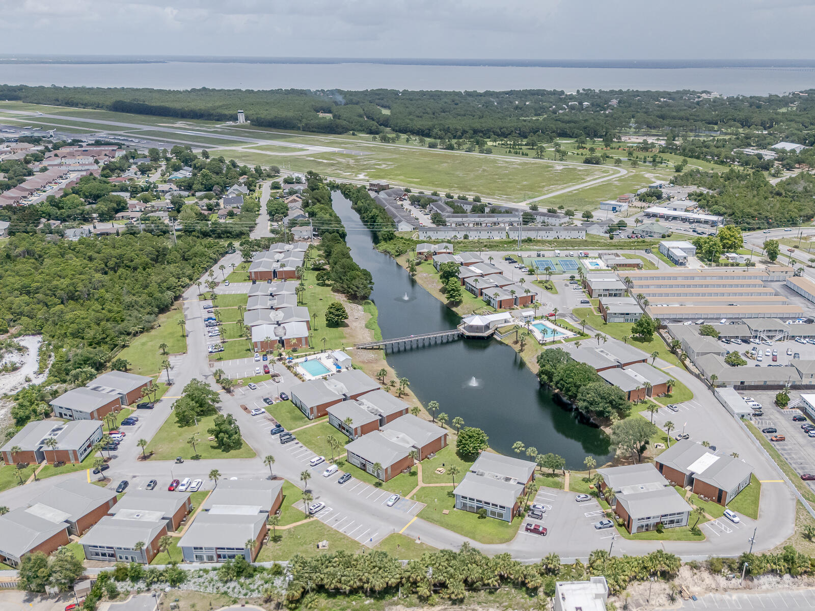 Affordable Destin Condo with Low HOA and Central Location. One of the few properties where All Rental types are Allowed and Pets. Primary Residence or Investment Property. Lake views right from your living room! Condo is situated on the ground floor for easy access. Granite Countertops, New HVAC and Water Heater, Tile Floors throughout, New Paint, Washer/Dryer Hook Ups in the unit. Gulf Terrace Complex is a gated community, free parking, pets are allowed and resort like amenities, 3 new swimming pools, lake, tennis / pickle ball court, homeowners club house. Centrally located to all Destin's attractions, restaurants, shopping, entertainment, beach access 0.8 miles away. All measurements are approximate and to be verified by buyer. All information to be verified by buyer. This first-floor condominium presents a fantastic investment opportunity with NO RENTAL RESTRICTIONS, allowing for flexible income potential. It is part of the most affordable complex to own in Destin. All offers are welcome! No Flood Zone! Community Features: gated entrances from HWY 98 and Airport Rd, Access to 3 swimming pools, including one heated, Tennis/pickleball court and a clubhouse for owners. HOA Coverage: The monthly fee covers building insurance and exterior maintenance, water, internet, sewer, trash, landscaping, and maintenance of pools and gates, ensuring low maintenance for the homeowner. See More Section
Seller's Motivations and Additional Property Features:
The seller is motivated and willing to assist with closing costs, making this an even more attractive opportunity.
The complex offers convenient boat parking exclusively for owners at a minimal monthly fee, catering to those who love boating adventures. Additionally, the on-site laundry facility is undergoing a remodel to enhance its modern look and efficiency.
Located just 0.7 miles from public beach access, this property positions residents right across the street from the Gulf of America. This condominium is in close proximity to popular attractions such as the Morgan Sportsplex, The Track, Big Kahuna Waterpark, and the Sun Destin Hotel featuring the PhatFish Restaurant. These nearby destinations add significant appeal for both residents and potential renters. Within the complex, you'll find Quail Lake, a recently stocked catch-and-release natural aquifer, perfect for leisurely fishing and relaxation.