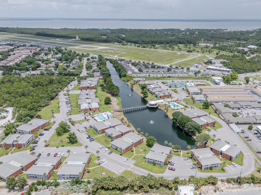 Destin Condo Central Location in Gulf Terrace Complex, located on the ground Floor with Lake View. One of the few properties where All Rental types are Allowed and Pets. Primary Residence or Investment Property. Granite Countertops, New HVAC and Water Heater, Tile Floors throughout, Washer/Dryer Hook Ups in the unit.  GULF TERRACE COMPLEX IS APPROVED FOR VA FINANCING, a gated community with EV Charger station, free parking, pets are allowed and resort like amenities, 3 new swimming pools, lake, tennis / pickle ball court, homeowners club house. Centrally located to all Destin's attractions, restaurants, shopping, entertainment, beach access 0.8 miles away. All measurements are approximate and to be verified by buyer. See More Section All offers are welcome! No Flood Zone! Community Features: gated entrances from HWY 98 and Airport Rd, Access to 3 swimming pools, including one heated, Tennis/pickleball court and a clubhouse for owners. HOA Coverage: The monthly fee covers building insurance and exterior maintenance, water, internet, sewer, trash, landscaping, and maintenance of pools and gates, ensuring low maintenance for the homeowner. See More Section
The complex offers convenient boat parking exclusively for owners at a minimal monthly fee, catering to those who love boating adventures. Additionally, the on-site laundry facility is undergoing a remodel to enhance its modern look and efficiency.
Located just 0.7 miles from public beach access, this property positions residents right across the street from the Gulf of America. This condominium is in close proximity to popular attractions such as the Morgan Sportsplex, The Track, Big Kahuna Waterpark, and the Sun Destin Hotel featuring the PhatFish Restaurant. These nearby destinations add significant appeal for both residents and potential renters. Within the complex, you'll find Quail Lake, a recently stocked catch-and-release natural aquifer, perfect for leisurely fishing and relaxation.