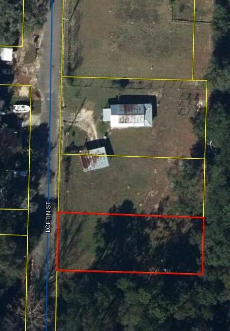 Great building lot inside the City of DeFuniak Springs. Level lot that has survey completed, parcel ID assigned and ready for the new owner. City utilities and power are not in place but readily accessible. The lot is fenced in the back. Two identical lots side by side, make a larger yard or build two homes. Don't let this one get away!
