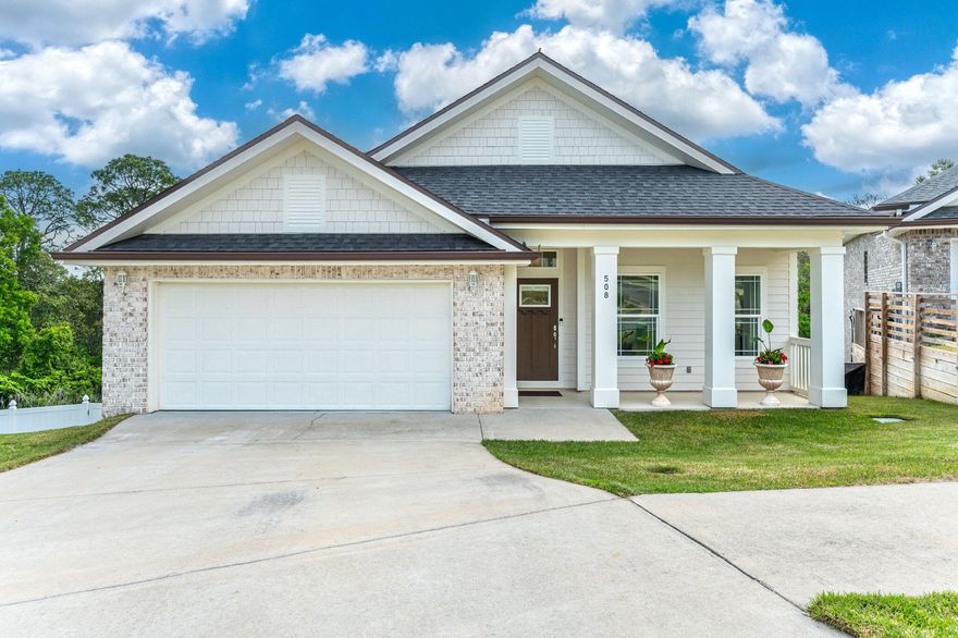 **Assumable VA Loan with 2.99% interest rate for qualifying borrowers!** Situated on a premium lot with peek-a-boo views of Boggy Bayou, find 508 Harborview Circle, a beautifully appointed 2022-built 4-bedroom, 3-full bathroom home. From the street, this brick home with hardy board accents presents a modest footprint, but inside, discover a unique and highly desirable two-level floor plan boasting over 2700 square feet of elegant living space. A gracious covered front porch welcomes guests to the front door and into the main level of the home. To the right of the foyer, find a light-filled front bedroom and full bathroom. The hallway opens to the heart of the home: an impressive open concept kitchen, dining, and living space crowned with a distinctive coffered ceiling. The gourmet kitchen  boasts upgraded quartz counters, bi-level center island, white shaker-style cabinets, natural gas range with designer vent hood, and abundant counter space. A walk-in corner pantry leads to a conveniently located laundry room with built-in storage shelving and a window bringing natural light to the space. A stunning gas fireplace with brick surround and natural wood mantle serves as the centerpiece of the family room. Two sets of sliding doors provide access to the open deck offering expansive and peaceful views of the backyard, mature forested area, and Boggy Bayou beyond. It's the perfect setting for entertaining, grilling, and relaxing. Situated at the back corner of the home find the primary bedroom suite complete with ensuite bath highlighted by a wide double sink vanity, large-format marble-look tiles on the floor and shower, walk-in closet, and separate water closet. Venture downstairs to the lower level complete with a massive and flexible living room, two bedrooms, a full bath with quartz counters and a tub/shower combo, tons of storage, as well as direct access to the spacious, fully fenced backyard! Hideaway Ridge is a quaint neighborhood consisting of just 17 residences all sharing a charming, Craftsman aesthetic and a quiet, secluded location just minutes from Eglin, VPS Airport, Northwest Florida College, Twin Cities Hospital, and a short drive to the famed white sand beaches of the Emerald Coast. 
 

