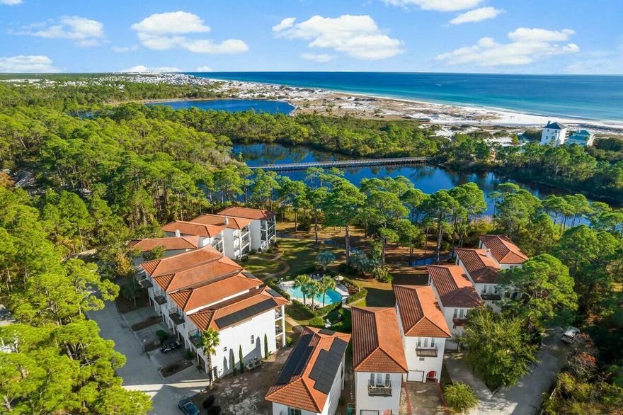 Discover your perfect home at 68 Mar-A-Lago, a stunning Mediterranean-style residence that beautifully blends tranquility with convenience. This inviting property features elegant quartz countertops, stainless steel appliances, and hardwood flooring throughout. The open-concept first floor seamlessly connects the kitchen, living room, and outdoor balcony, creating an ideal space for family gatherings and entertaining. On the third floor, the primary bedroom offers breathtaking views of the lake and gulf, complete with a private porch perfect for enjoying your morning coffee. With ample parking provided by a garage and driveway, you'll never have to worry about space. Located in a private community with access to a pool and just a short stroll from public beach access, this home is surrounded by natural beauty and recreational opportunities. With its excellent rental potential, this property is perfect for those seeking a long-term residence in a serene setting. Don't miss out on this incredible opportunity!