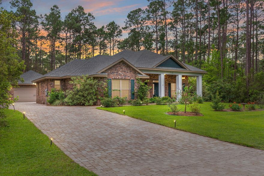 Welcome to Peace and Serenity in your Custom Built Immaculate home with Oversized lot! Very private location with west and south sides bordering preserve area in Holley by the Sea; As you enter home, the beautiful paver driveway exudes class and style! This luxurious Robbins built 4 bedroom 3 bath split floor plan with screened in patio has private backyard that backs up to woods; Home has crown molding throughout and Gas and Electric utilities; Beautiful tile entry and tile (wood look) in main areas with some carpet in bedrooms; Door entries are handicap accessible with 10' ceilings! Open Kitchen has stainless steel appliances, eat in bar area and separate breakfast area with windows looking out to backyard; Large living area also opens to peaceful backyard;Master bedroom has trey ceiling