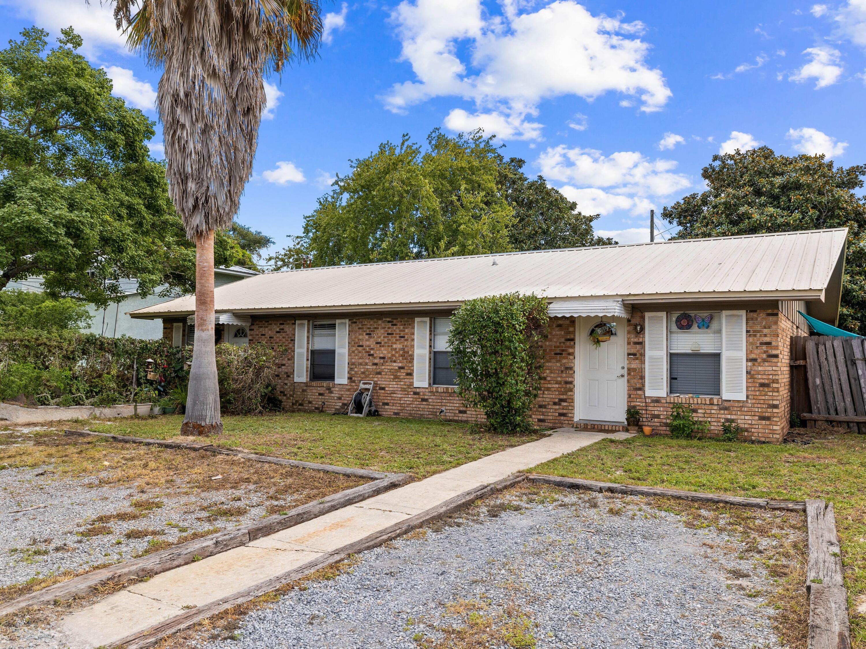 This charming four-bedroom, two-bath duplex, located in the desirable Lakeside Villas community, offers 1,664 square feet of comfortable living space. Situated south of Highway 98, this home provides easy bike and golf cart access to the beach, making it an ideal coastal retreat. Perfect for investors, second-home buyers, or those looking for a primary residence with income potential, this property offers the flexibility of both short-term and long-term rentals. The interior features newer paint and tile flooring throughout, creating a fresh and inviting atmosphere. Enjoy the convenience of being close to Pier Park and beach access on the west end of Panama City Beach. This location ensures you're never far from shopping, dining, and entertainment, while still offering the tranquility of a residential neighborhood.