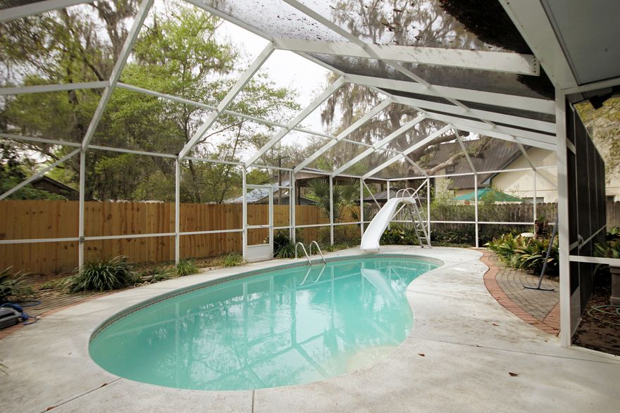 This 3-bedroom, 2 bath home is located just a Street over from Bayshore. This home provides that slow life experience of days gone by. The fully fenced yard is lushly landscaped, urging you to spend the day reading a book in a hammock or floating in your screened-in pool listening to your favorite tunes. Enjoy the bayou by taking a picnic to Lions Park only a 10-minute walk away. On those super-hot Florida days, you can still enjoy the beauty of the outdoors but with the luxury of air conditioning in your attached sunroom. The front porch is perfect for that morning cup of coffee and additional space for quiet.The inside of this home is perfectly suited to Florida and it's Sandy conditions with oversize tile throughout high traffic areas, cleaning will always be a breeze.