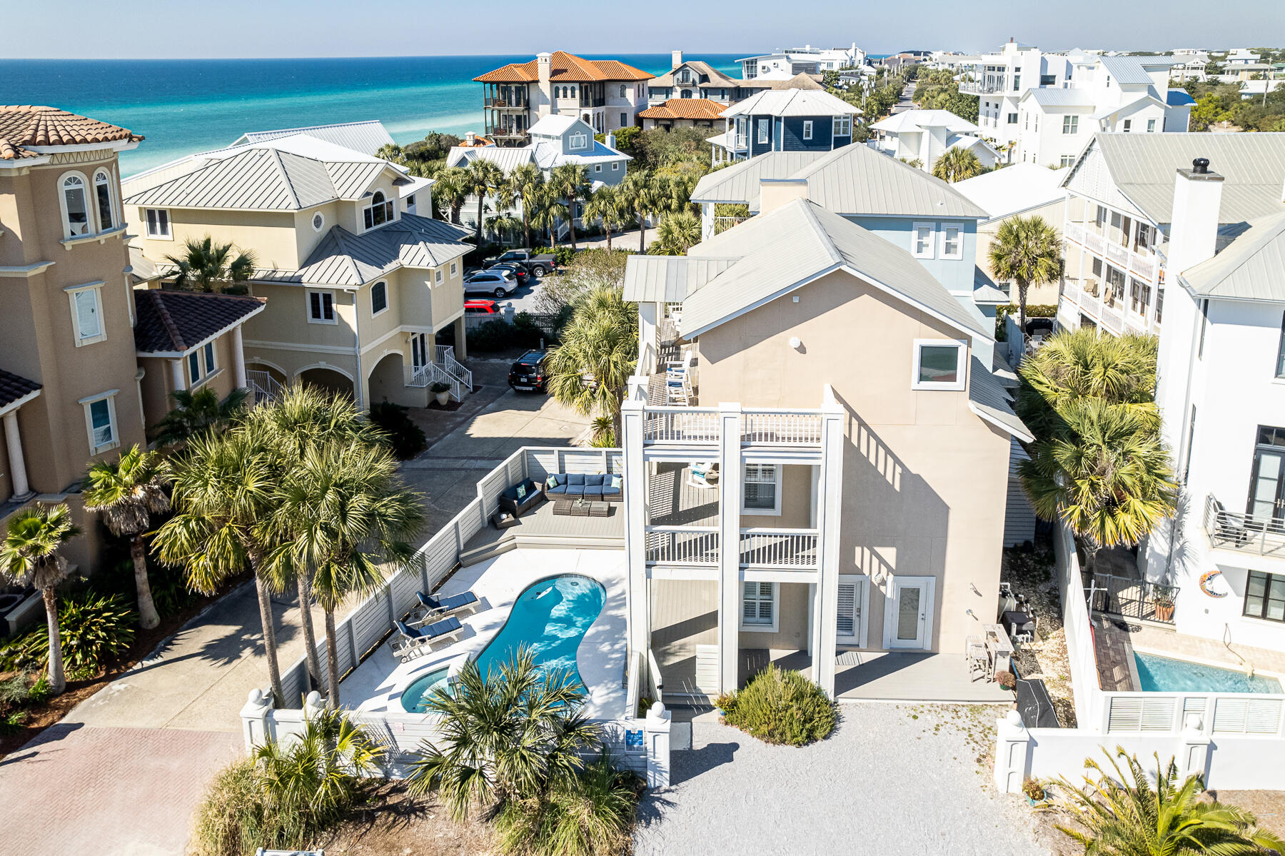 South of 30A in the heart of Seagrove and one mile from Seaside.  One row back from Gulf-front.  Home features oversized balconies and Gulf views from every bedroom.  Only a few steps away from the community's private beach boardwalk access.  After a day at the beach, enjoy the full size pool and hot tub while still listening to the waves.  The expansive pool deck provides ample space for lounging and entertaining.   The open living space and kitchen opens to the large outdoor pool deck.  The second floor consists of three bedrooms and one bath.  The top floor is a dedicated owner's retreat, offering a fireplace and separate living space designed to feature Gulf views from every window in the room.  Luxurious spa-inspired bath, you will never want to leave.