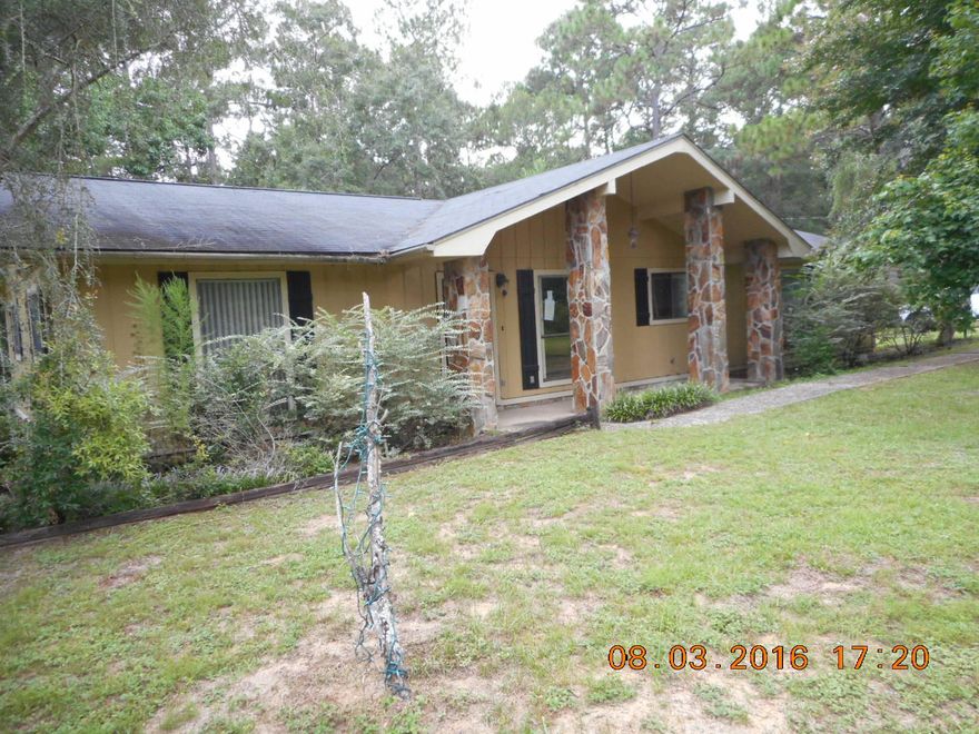 Home is conveniently located in Defuniak Springs fronting Co Hwy 280E, near lake yard. Large yard with plenty of room on 1.29 acres. Home has attached carport, fireplace, split bedroom floor plan, formal dining room. Home has lots of appeal and can be made into the home of your dreams.