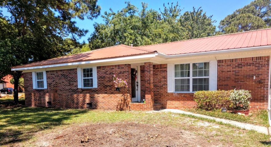 BIG IN ALL THE RIGHT PLACES with great space for everyday living and entertaining, this move-in ready 3 bedroom 2 -1/2 bath, all brick home has features you'll appreciate: situated on a corner-lot, a 2 car garage, a metal roof, WHOLE HOUSE NATURAL GAS GENERATOR, impact-resistant windows, alarm system, a sparkling 18' x 36' in-ground pool with a large open patio, a fenced backyard with double gate side entry, well pump for pool and sprinkler system and a large workshop/storage shed with its own A/C(as-is), an auto ramp, and a garage-style door perfect for those ''big boy toys''. You will love the open kitchen/dining area with real wood cabinets, gas range, solid surface counter tops, breakfast bar, double pantry, garden window, and French doors leading to the back patio, pool and yard.