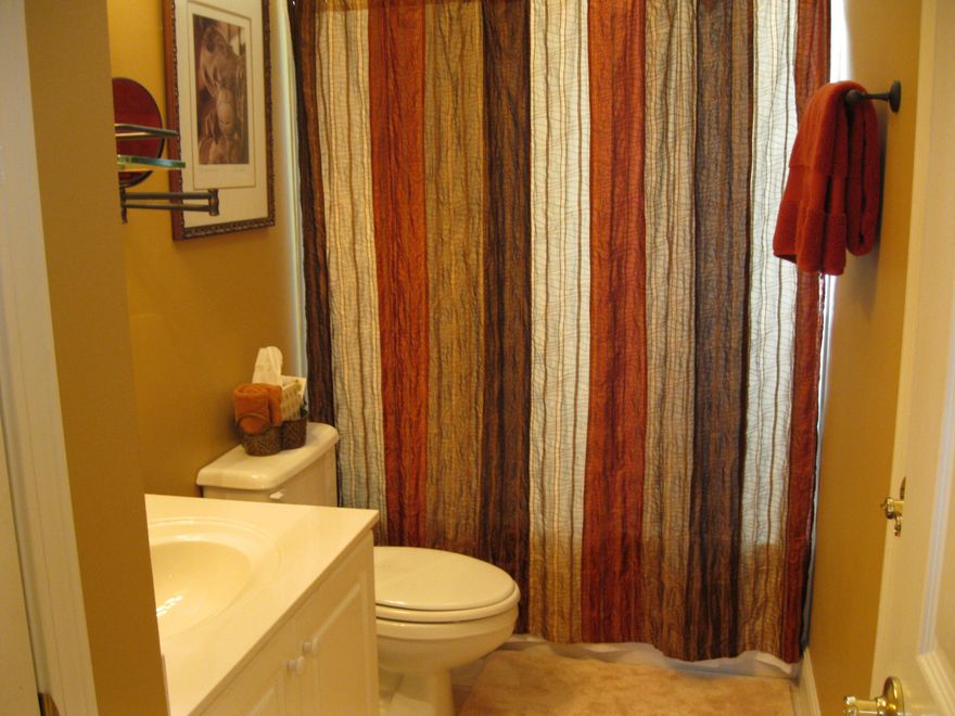 Beautiful hardwood floors are in the large living area along with a gas fireplace with an exquisite Backsplash. There is lots of storage space in this 3 bedroom , 2 1/2 bath home. You can sit out on the enclosed patio which overlooks the lake . You also have a view of the golf course.See Sellers disclosure under documents.