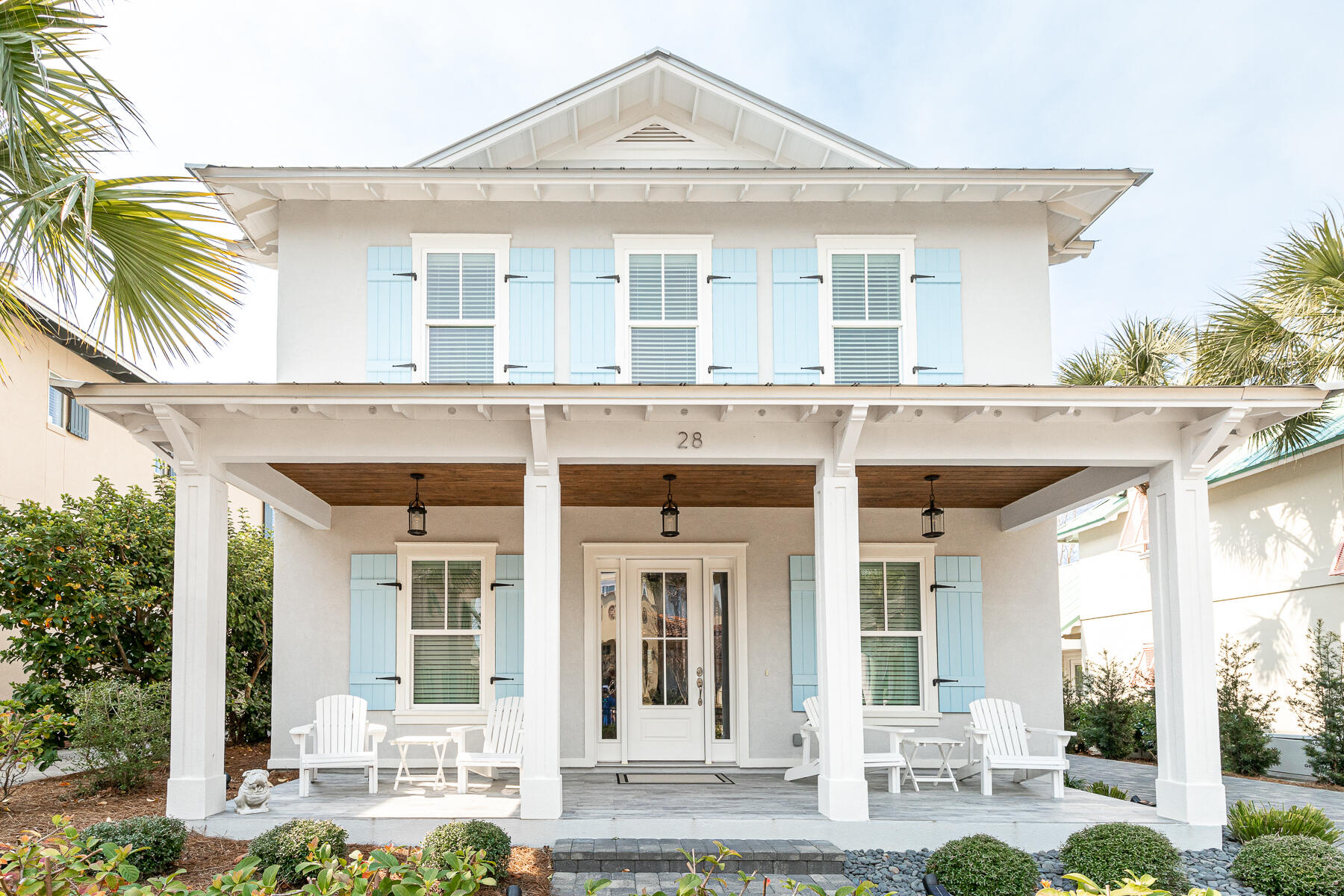 Rare, like new offering in exclusive, guard-gated, gulf front Caribe. This beautiful, 2019 built, one-owner furnished home is a short stroll from some of the Emerald Coast's widest, never crowded, snow-white beaches. With an open floor plan, this house has all the features you need for family time, hosting get-togethers or to earn over $100K in projected vacation rentals! The smart finishes of this 2879 SqFt 4 bed/4.5 bath home includes wall to wall shiplap in a coastal cottage design. Step inside to warm hardwood flooring found with a spacious family room and dining area ideal for entertaining. The well-dressed kitchen presents with stainless steel appliances, brick tile backsplash, soft-close cabinets, quartz counters, and a large kitchen island for prepping. Take your pick, this dual master suite home has 1st and 2nd level master retreats. The 1st level suite features a bathroom with two vanities, soaking tub, separate glass enclosed spa shower, and walk-in-closet. This level is equipped with washer/dryer. Take the hard wood stairs up to the loft area which serves as great additional living space for sleeping and gaming. One of the three 2nd level bedrooms is outfitted as a bunkroom.
The back patio is paved and ready for grilling. The rare detached, enclosed garage comes stocked with a golfcart. Residents of Caribe enjoy private beach access, 2 pools, a private lake & tennis/pickleball courts, a security guard, and meticulously maintained lush grounds.