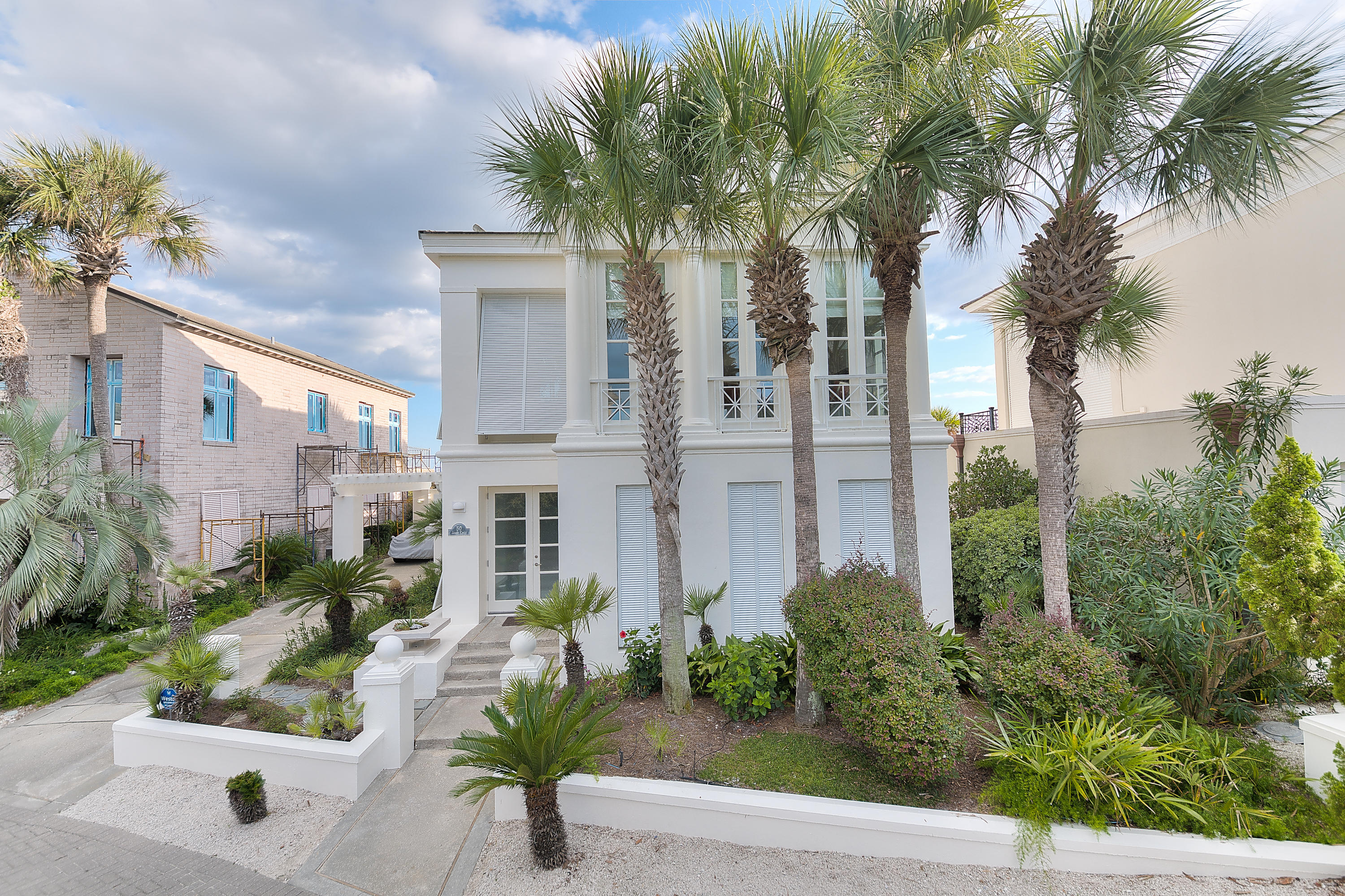 This Gulf Front Mediterranean Stucco Villa is situated in the tranquil gated community of Jasmine Dunes on the South side of 30A in the heart of Seagrove.Completely renovated and interior design by A Boheme in 2010, the custom luxurious finishes and refined tasteful details throughout this home makes the statement of necessity meets luxury.Standout finishes include pristine white Carrara marble floors in every room on the first floor. Carrara marble countertops and subway marble tile in all bathrooms.Upon entering this home of understated elegance and refined luxury, one will immediately be drawn to the double height entry with picture window allowing for abundant warm and natural light to play against the home's crisp white and neutral color palette.