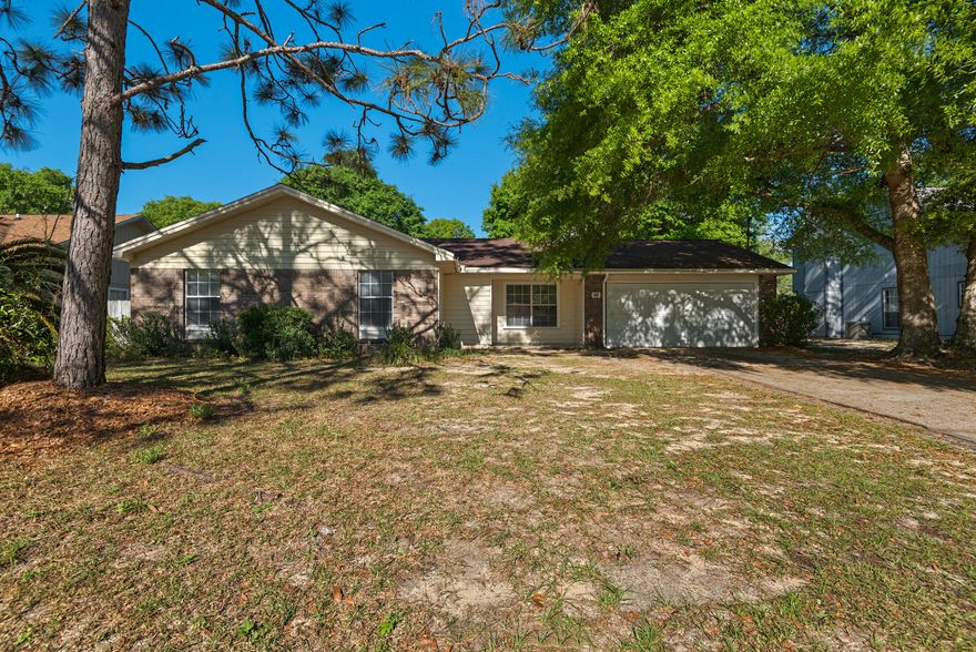 Peaceful and quite cul de sac neighbohood,Great location for hospital, shopping, and restaurant, large lot with beautiful trees. Rooms are freshly painted. Natural light access in the kitchen with tiles flooring. Carpet flooring in the living room with fire place. Large Covered Patio in the Backyard, you can screen it and enjoy watching birds or watching your kids playing. With a large lot, you can expand your home or simply park you RV in the back yard with both sides of the house are accessible for entry. Bathrooms are tiles flooring. You can not find this home with a great location! You must See!