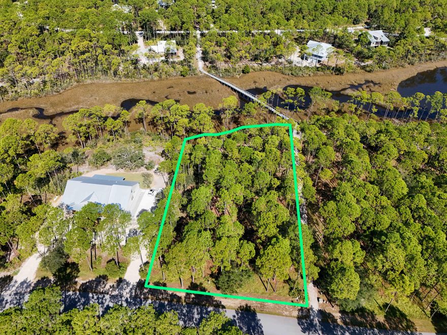 Discover the perfect spot to build your dream home on Lot 114, a stunning and private .95+/- acre wooded lot in the sought-after RiverCamps on Crooked Creek community. This lot offers breathtaking views and is nestled in a serene, natural setting, providing both peace and tranquility while being just minutes from the white sandy beaches, upscale dining, and premier shopping. Conveniently located near Panama City International Airport, this is the ideal location for both privacy and accessibility. RiverCamps is designed for those who cherish the water and the outdoors. Residents enjoy top-tier amenities including fishing, paddleboarding, a boat ramp, and access to Crooked Creek, West Bay, and the Gulf of Mexico. The community is surrounded by Crooked Creek, the Intracoastal Waterway, and 18,000 acres of West Bay, offering endless opportunities for boating, hiking, and wildlife viewing along scenic trails. With its rich natural beauty and ample recreational activities, RiverCamps is a paradise for outdoor enthusiasts.