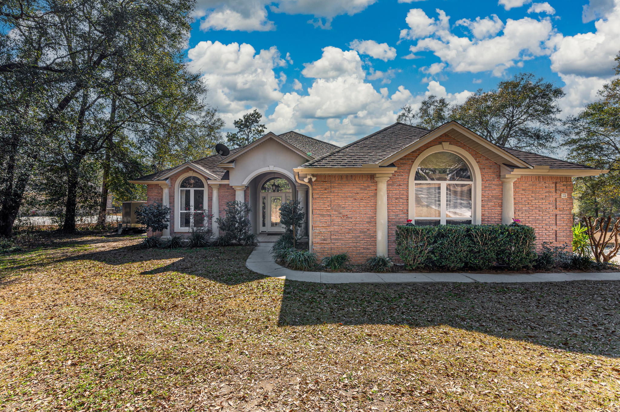 Amazing Waterfront Property located in Indian Trails! Stunning 3 bd/2 ba home built by a Parade of Homes winning builder is situated on a 1/ acre lot. The home features an inviting entry, spacious living room and open floor plan concept. The kitchen boasts beautiful upgraded cabinetry, granite countertops, stainless appliances and center island with breakfast bar.  The living room has a gorgeous fireplace w/ built-in shelving surround to display all your pretties. Oversized master bedroom suite features dual vanities, garden tub, separate shower and dual closets. Two additional bedrooms and bathrooms are all a nice size. 'Piano room' has endless possibilities. Relax on your spacious screened-in back porch and enjoy the amazing views of Arrow Lake. Buyer to verify all areas of importance.