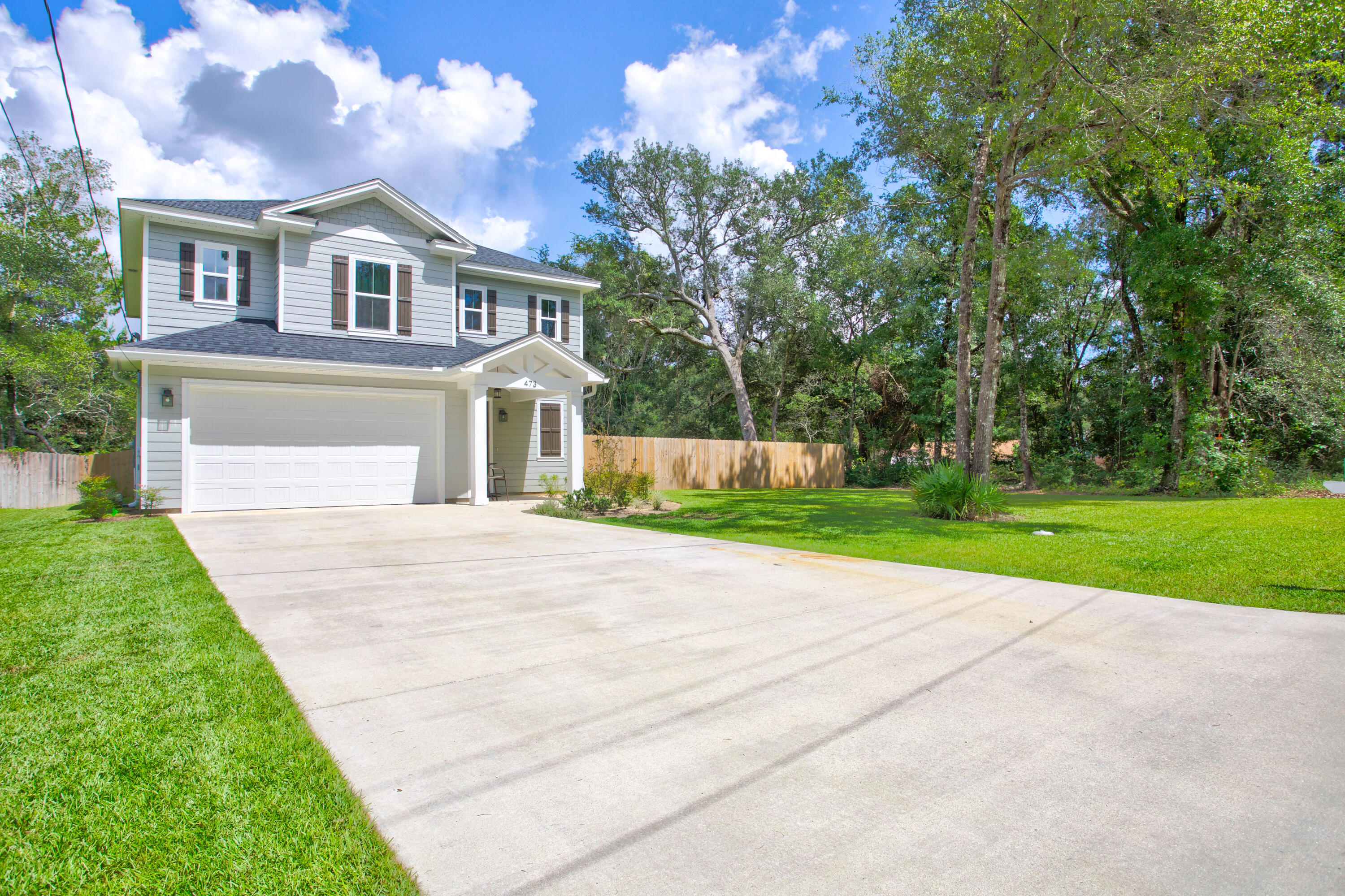 ** VA ASSUMABLE INTEREST RATE OF 3% AVAILABLE** Welcome home to this like-new 4 BR home in the heart of Valparaiso! Completely move in ready with white shaker cabinets, white quartz countertops, and an apron front sink! The home boasts an open floor plan. Great for entertaining and family gatherings. Luxury Vinyl Plank flooring can be found throughout the main area. The master shower has designer tile , double vanities, and a large walk-in closet. Fenced in backyard is perfect for furry friends and kids alike. There's an additional wooded area on the side of the property that is partially cleared and being fenced in prior to closing, which is perfect for adding a pool! This home has a TON of storage space as well. Come check out this stunning home today!