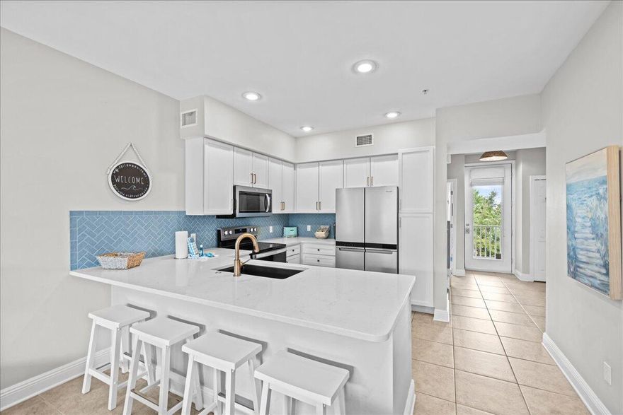 Heart of Blue Mountain Beach! This four bedroom 3 bathroom home is offered turn key and rental ready. The remodel of the kitchen was just completed in August of 2024! The location of Village at Blue Mountain Beach is behind the gates just off 30A. Walk to various dining, coffee, ice cream and shopping just at the entrance of this community. This 2 story condo lives large with open floor plan with 2 bedrooms and porch on first level and 2 more bedrooms with a bathroom on second.  The Village at Blue Mountain Beach has large pool, golf putting area, shuffleboard courts and walking trails.  The condo is sold fully furnished with coastal design. The updates include tile in showers, new washer and dryer, stone counter tops and new appliances in the kitchen. This condo is perfect for exploring all of 30A with easy beach access just at end of 83 or multiple walkovers just to the east.  Rental projections for this unit are around $50k This unit comes with a coveted golf cart spot that can be to new owner.  