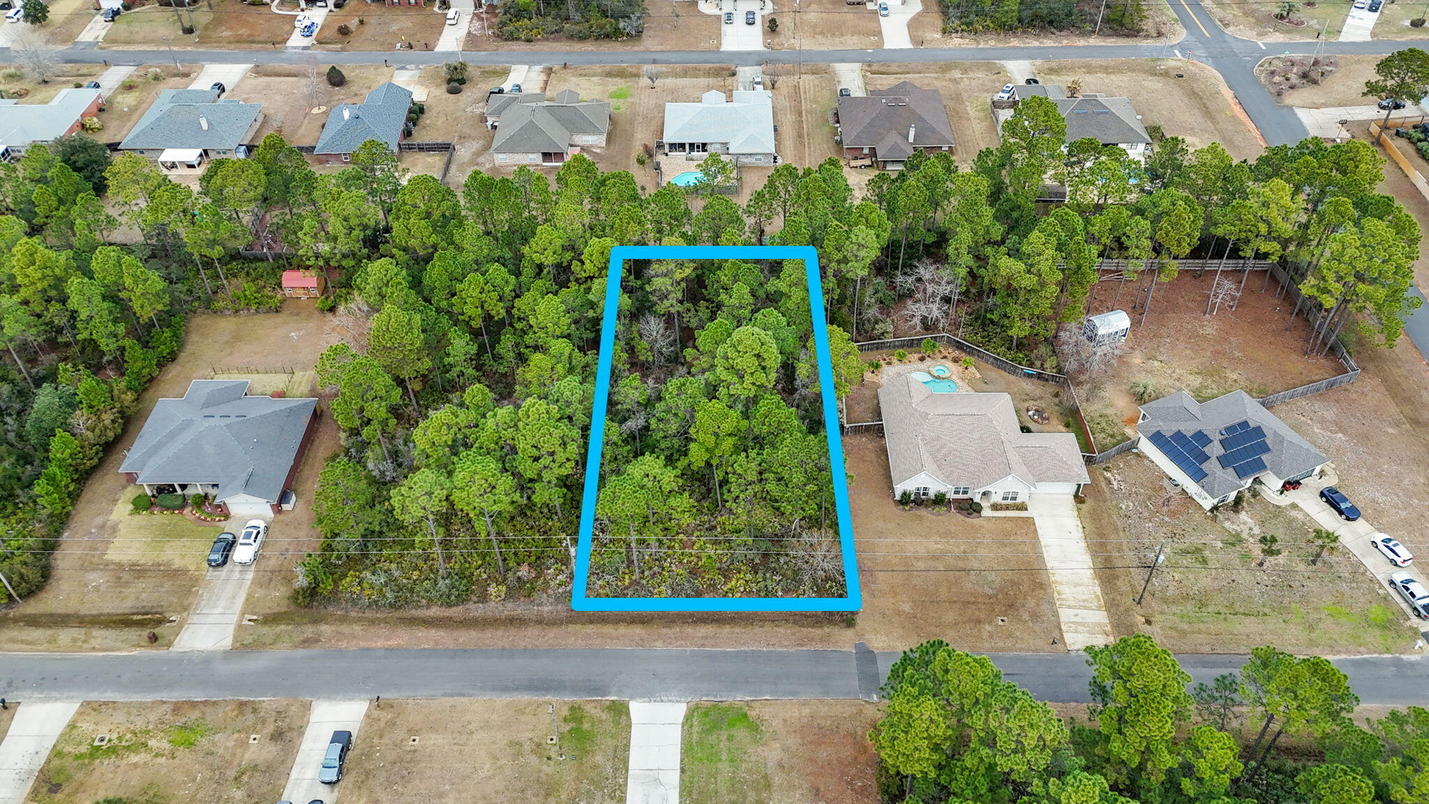 Come enjoy everything Holley by the Sea has to offer in this well located half acre lot. Wetlands study and survey available and found in documents. Ownership includes membership to Holley by the Sea's multi-million dollar 45 acre recreational center with 8 clay tennis courts, 3 swimming pools, full gym, aerobics, summer camp, lighted basketball courts, sauna and steam room, playground game room, community house on Santa Rosa Sound with playground, dock, access to the East Bay boat launch and many community events. Enjoy being only minutes to the emerald green waters and white sands of Navarre Beach!