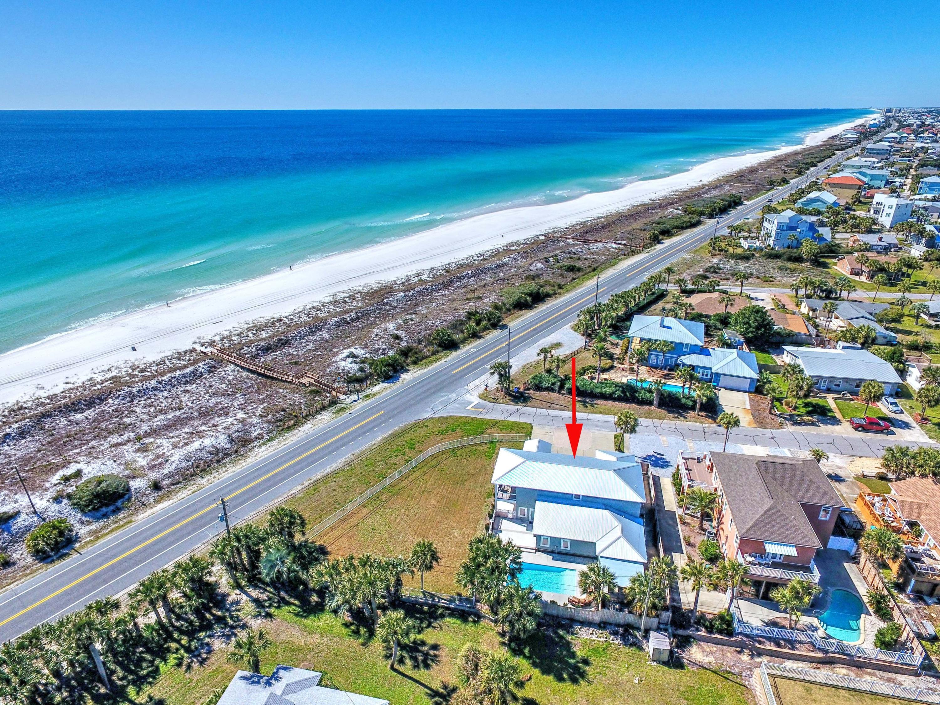 Exceptional investment opportunity! Located at the popular West end of Panama City Beach, this home is directly across the street from the private Santa Monica Beach access. It is perfectly positioned on an elevated, fenced, corner site to capture unobstructed, , panoramic views of the Gulf. There is impressive outdoor living space that is perfect for wedding venues or family yard games with plenty of room to add a two car garage with carriage house. A large gas-heated pool is surrounded by flickering lanterns, plenty of decking, an outside bar and covered dining and grilling area.This Coastal contemporary masterpiece spans over 3,500 sq. ft. and sleeps 19!
