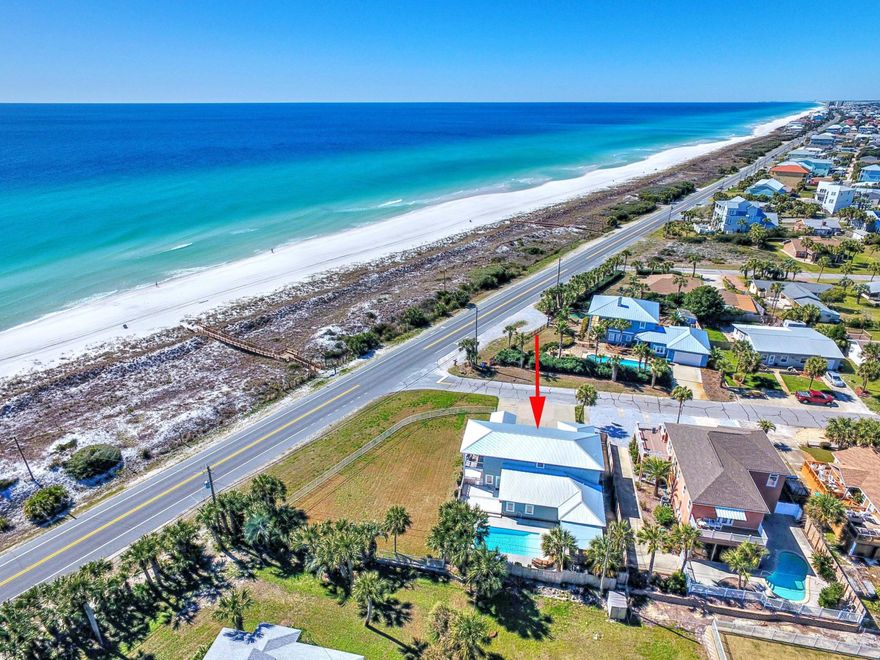 Exceptional investment opportunity! Located at the popular West end of Panama City Beach, this home is directly across the street from the private Santa Monica Beach access. It is perfectly positioned on an elevated, fenced, corner site to capture unobstructed, , panoramic views of the Gulf. There is impressive outdoor living space that is perfect for wedding venues or family yard games with plenty of room to add a two car garage with carriage house. A large gas-heated pool is surrounded by flickering lanterns, plenty of decking, an outside bar and covered dining and grilling area.This Coastal contemporary masterpiece spans over 3,500 sq. ft. and sleeps 19!