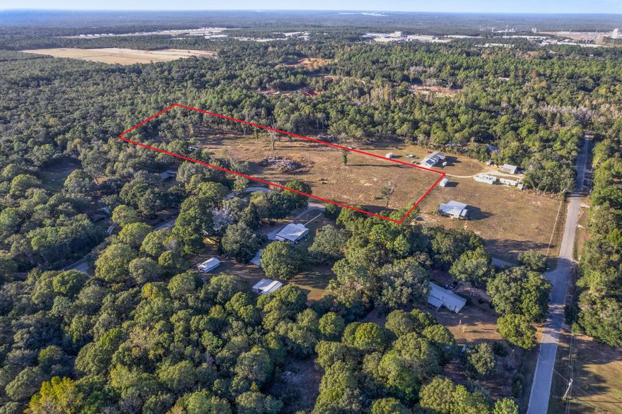 Over 7 acres of cleared, FULLY FENCED land offers an exceptional opportunity for development in a prime location near the intersection of I-10 and Highway 87 in Milton! This property is secured with Industrial-Grade livestock fencing, making it ideal for a variety of agricultural uses or any animals requiring secure enclosure. Zoned for Agriculture, Rural Residential, and Commercial use, this parcel provides flexibility for builders, developers, or investors looking to capitalize on its potential. The land can be subdivided, opening the door to a range of development options -- from private homesteads to commercial ventures. Enjoy the best of both worlds with easy access to major highways and a peaceful, rural setting. City water is available, making this property ready for immediate devel opment. Whether you're planning to build, invest, or expand, this versatile acreage is a rare find with endless possibilities.
