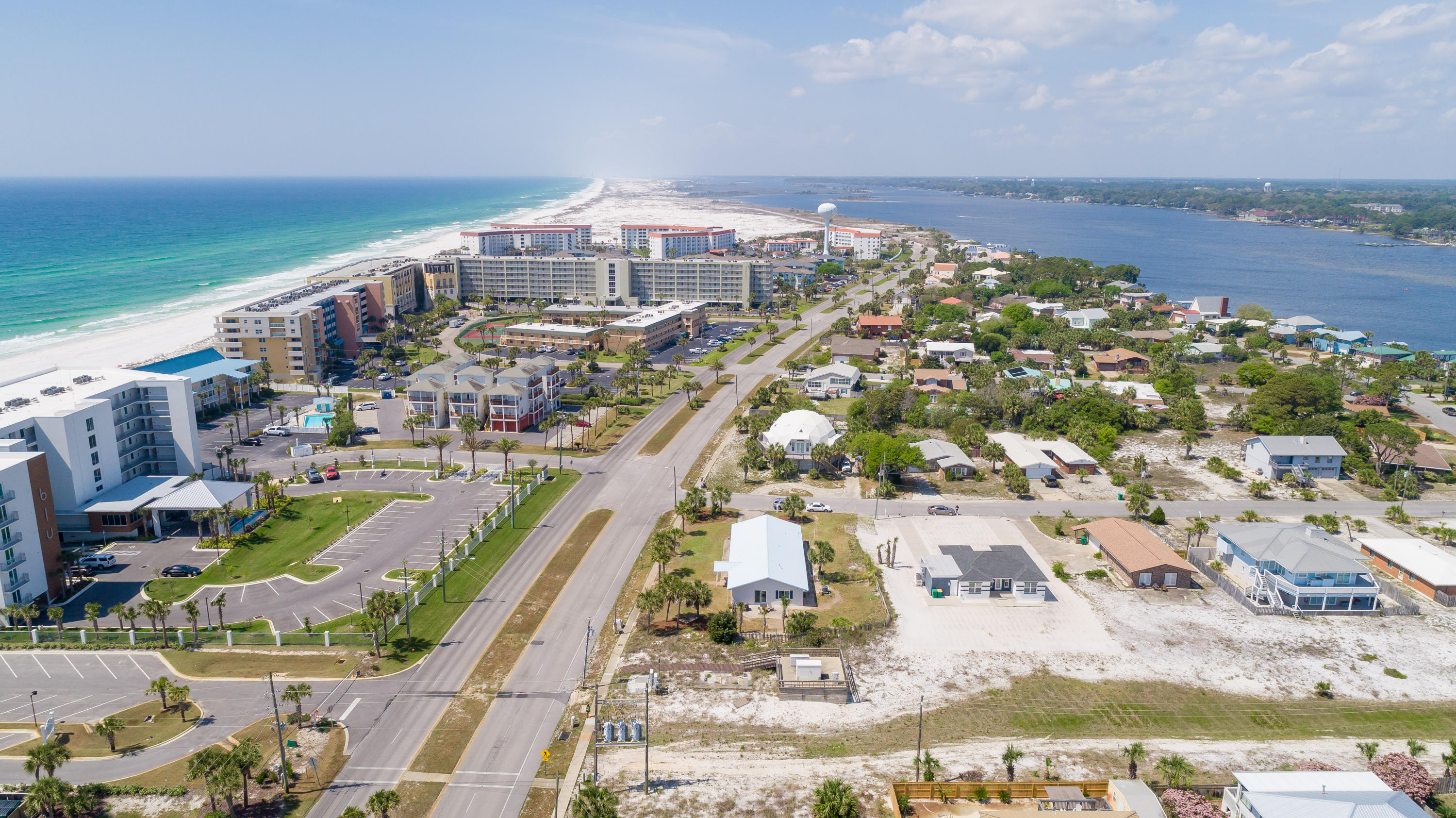 Here is your new beach home! Four bedroom/ 3 bath split-floor plan home, right across the street from newly built Okaloosa Island beach access #6! Imagine walking right across the street to paddleboard, or just play in the gulf! This concrete block home has been tested through time, and updated for the future. Since 2016, updates included are new impact resistant windows throughout, a New Trane HVAC with air purifying technology, an updated kitchen (appliances and counter), vinyl plank wood-look floors throughout, all three bathrooms beautifully renovated, new impact doors, and backyard fencing. It also has new elastomeric paint over roof and exterior, 7 new palm trees, and an irrigation pump for the sprinkler. The home has an oversized garage, perfect for hobbyists/woodworkers etc.