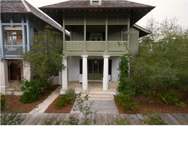 This lovely Rosemary Avenue beach house with attached carriage house is elegant yet casual. Located just steps from the beach with beautiful gulf views from the balcony, the charm of this house is found in the details. The first floor exterior walls are 12'' board-formed concrete, reminiscent of the earliest Florida homes in St. Augustine which is the essence of Rosemary Beach. Once inside you will find stone floors, plaster and bead board walls. The ceilings are bead board throughout and old beams span the first floor open living area which includes living room, dining area, kitchen, pantry and half bath. Ascend the stair steps hewn of reclaimed, antique oak to a gallery-style hallway that gives the impression of being in an enclosed porch.