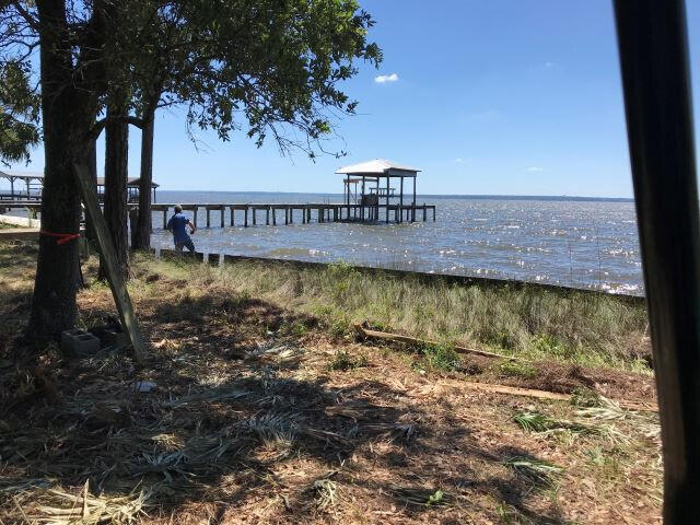 Beautiful one of a kind waterfront lot located on Escambia Bay. Only eight bay front lots on this quiet dead end road and this is the only lot that remains undeveloped. This level lot is 0.67 acre and is populated with hardwood and pine trees. This is a deep lot with 100' of bay frontage. There is a seawall and some riprap. Dock permit is in progress. This lot also has deeded access to neighboring Raccoon Bayou.