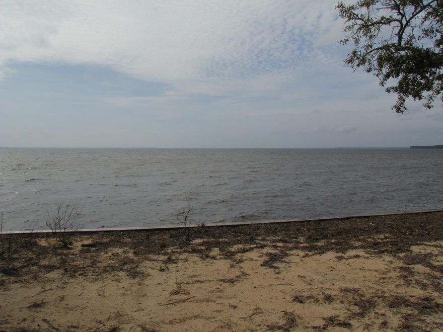 Approximately 77 feet of Bay frontage! Beautiful views of the Choctawhatchee Bay from your back yard! Newer sea wall and rip rap. Fairly level lot with lots of room, nearly 200 feet deep. Nice community amenities including a tennis court, basketball goal, boat dock, and a separate outside storage area for owners! Store your RV there! Approval needed for building plans. Low HOA fees!