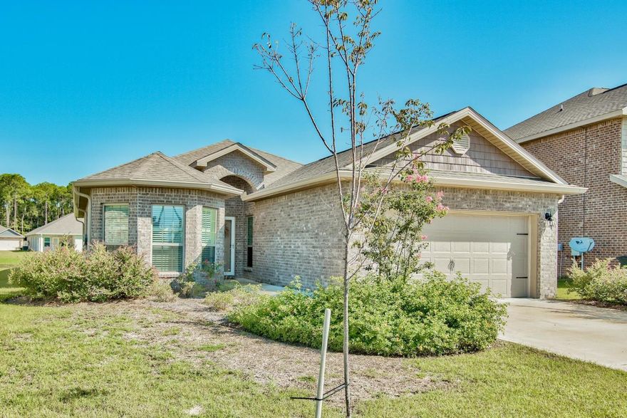 Gorgeous 'Like New' home located in Driftwood Estates. This 4 bedroom, 2 bath sits on a premier water front lot with 50 ft of frontage. As you enter the home it features a very open floor-plan with beautiful hardwood floors in the main living areas with carpet in the bedrooms and tile in baths. Beautiful cabinetry with stainless steel appliances and granite counter-tops. The family room is central to the home and opens to both the breakfast area, dining room and kitchen. The master bedroom is very spacious and faces the back of the home. The M/bath features dual sinks, a large walk-in closet, separate tub and shower. The laundry room is large and and features a shelf and kitchen pantry. Laundry room is located off the garage and opens into the kitchen. Great screened porch