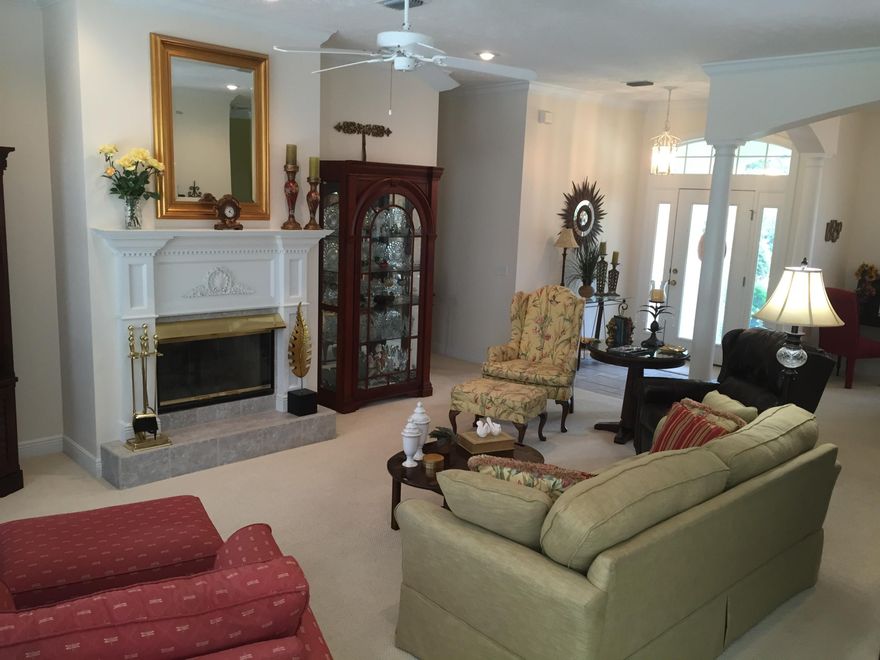 Immaculate beautiful home nestled in a culdesac to provide the utmost privacy. The Kitchen has ceramic tile floors and ceramic countertop with backsplash of ceramic as well. There is a lovely breakfast nook facing the natural wood setting in your backyard. This home features a large family room with a beautiful gas fireplace and mantle with a large bank of windows facing the natural Preserves. Berber carpet is in the family room and all bedrooms. Crown molding and large baseboard adds to the look of this grand home, and a large open foyer. This is a split bedroom plan. The master bedroom is very large with a double vanity in the master bath, jacuzzi tub, separate shower and large walk in closet. Enjoy sitting outside on the very roomy screened in porch. Brand new roof in 2012.