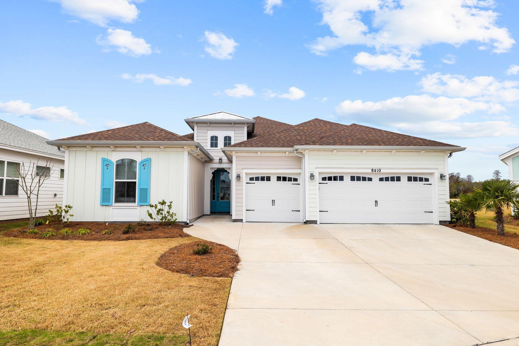 Rare opportunity to purchase a completed home in the beautiful community of Latitude Margaritaville WaterSound! This 3-bedroom plus office/den home has three garages perfect for your cars and golf cart, as well as a covered lanai with a private, screened pool! Newly completed in 2022 this St. Bart plan home is ready to move in and enjoy now! Upgrades galore: upgraded interior doors, under cabinet LED lighting, gas fireplace, gas stove, attic storage at garage, quartz countertops, cushion close drawer and cabinets, upgraded cabinets with pullout shelves, upgraded flooring, gutters, LED recessed lighting, and private heated pool with hot tub are just a few, You will enjoy this premium, picturesque lot with pond views located in the beautiful new community of Margaritaville Latitude.