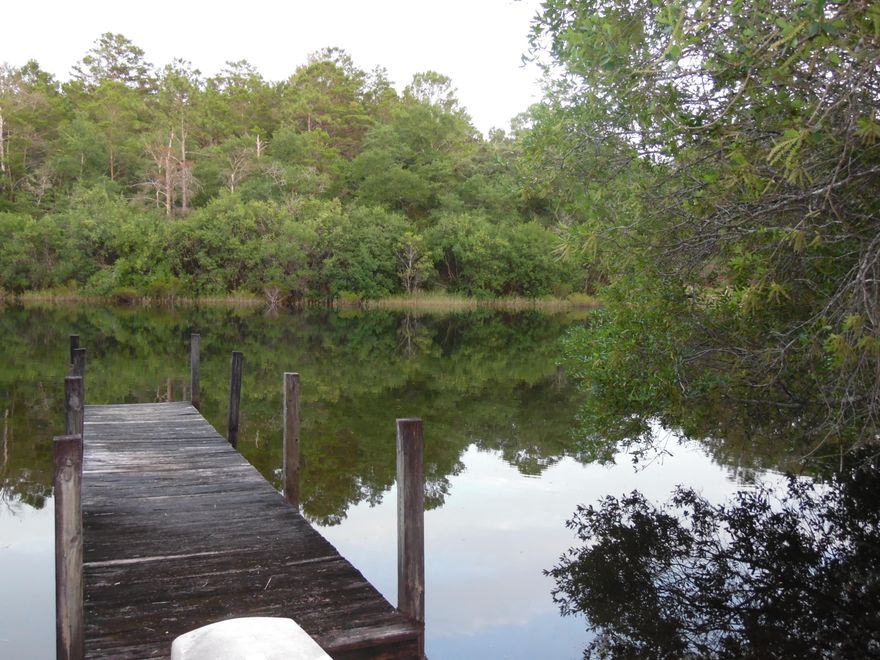 This one of a kind waterfront property on appox. 1.9 acres. Has a water tap and septic (septic subject to buyers inspection). This beautiful place is partially cleared with wonderful shade trees, water faucets, picnic tables, paddle board rack, benches, and dock. A great weekend retreat or come and build your dream home on this beautiful property. Please see the documents for the restrictions and current survey.