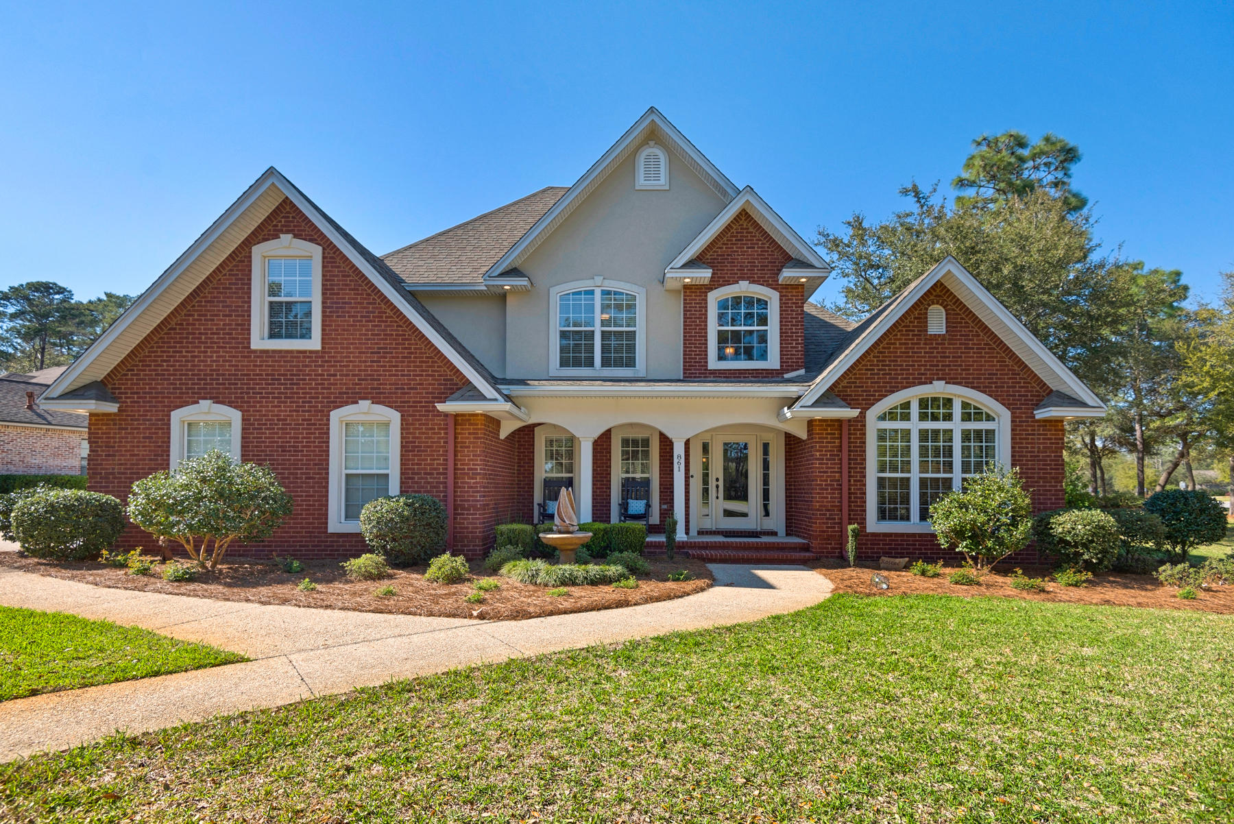 Welcome home to this Swift Creek stunner! You'll love this breathtaking corner, half acre lot, situated deep within the neighborhood yet close to the community amenities. Filled with mature landscaping, lush gardening, and mature trees, this home has some of the best curb appeal in all of Niceville! From the covered front porch, which is great for sitting in rocking chairs, you'll enter this almost 3000 sqft home and will be greeted by vaulted ceilings and lots of natural light! The foyer leads to the formal dining room that will be great for hosting holiday meals. The first guest bedroom is also easily accessible from the foyer and boasts lots of natural light. This bedroom has direct access to the first floor bathroom. (*CLICK ''MORE'' to continue reading)