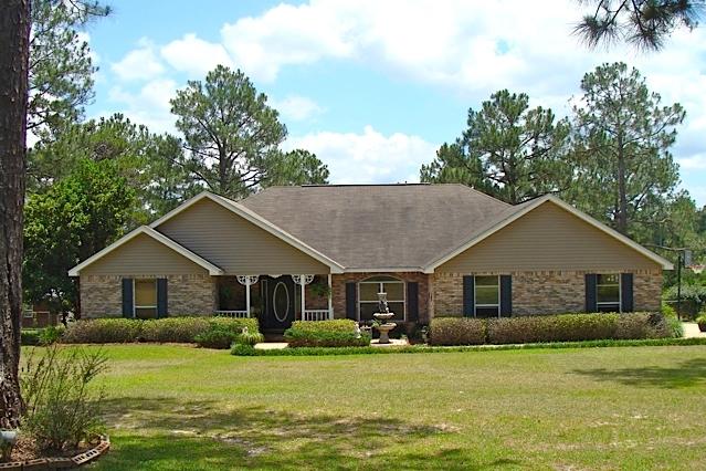 WATERFRONT BRICK BEAUTY! You'll love this beautiful brick 4BR 2BA rancher on an oversize 1.3 acre lakefront lot in popular Ten Lake Estates. Built in 2003 and lovingly maintained, thiS home features a split floor plan, vaulted ceilings, stainless appliances, cherry cabinets, and gas log fireplace. The inside of the house was newly painted and new carpets installed less than 2 years ago. New central heat & air in 2015. The back yard is family friendly with a beautiful back porch, deck, and hot tub. You'll enjoy views of the biggest lake in the subdivision, your own dock, and 140' of spring-fed lake waterfront full of bass and record sized brim. Enjoy lake-front living just 5 miles north of DeFuniak Springs and 35 miles north of our Gulf beaches. Sellers are motivated!