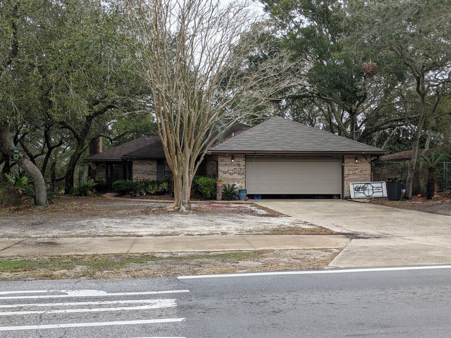 Dont miss out on this fabulous opportunity to own in the Heart of Destin. Located directly across from the elementary school on a corner waterfront lot. Home is being sold ''AS IS'' it needs some love and a little TLC to be made your own. Great investment, flip, rental, or primary home potential.