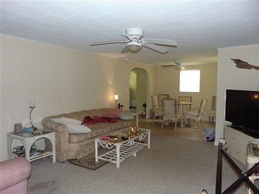 Great starter or 2nd home located just outside of town. The back yard drops down to a small pond with dock and this could be a beautiful lot with some clearing. This is a small, but surprisingly spacious home, with good sized living room, separate dining area, open kitchen, laundry/utility room. There is a portion of the front yard enclosed for small to medium size dog, which also adds great curb appeal. Storage shed. Seller may consider owner financing with 50% down. Schedule your showing today!