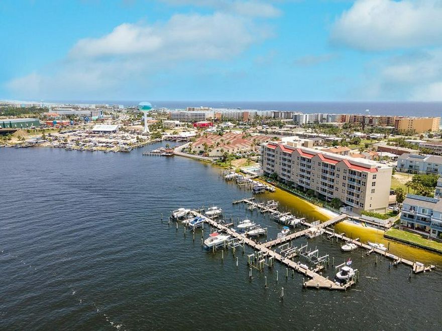 EXCEPTIONAL VIEWS FROM THE PENTHOUSE FLOOR, this 6th Level Furnished Condominium includes a 15 x 26 foot Boat Slip with a 10,000 lb. lift, #49! With the 2BR/2BA Condominium is nestled on the Sound Side of Okaloosa Island. The rooms are oversized, with a very large master, living/dining room and separate laundry room and 10 foot ceilings. That is right, being a top floor unit, the ceilings are 10' high! Across the street there is a boardwalk access to pristine beaches of the Gulf of Mexico, plus the complex features a sound-front pool and hot tub. Additionally, this complex is gated and the unit includes 2 under the building covered parking spaces, #39 & #40. Storage locker #50 and mail box #50 Short term rentals allowed, long term rentals allowed, pets with some exceptions. Don't hesitate this condo will not last long!  All dimensions and information herein is deemed reliable, but should be verified by buyer.