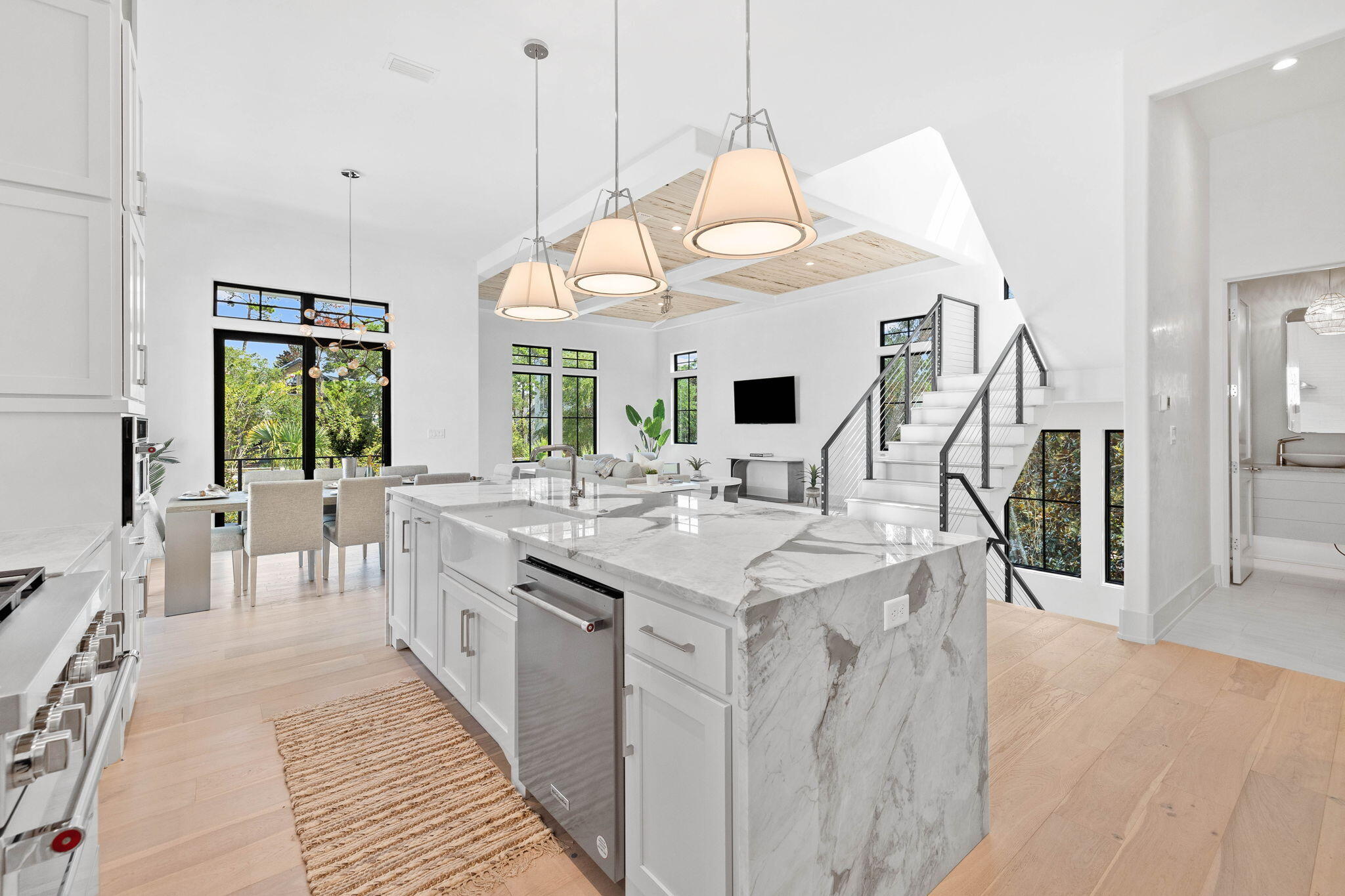 Discover the epitome of coastal luxury living in this meticulously crafted new construction residence. Boasting 3,201 square feet of thoughtfully designed space, this home offers more than just a place to live - it's a lifestyle statement. This property effortlessly combines convenience and sophistication.Step into your own private oasis with a heated in-ground pool, inviting you to unwind year-round. Immerse yourself in the exquisite interior, where washed Pecky Cypress accent ceilings and Venetian Plaster accents exude timeless elegance. Multiple living spaces provide versatility for both relaxation and entertainment.The en-suite baths and primary suite walk-in closets offer a touch of opulence, while the outdoor kitchen redefines al fresco dining. Polished nickel accent hardware