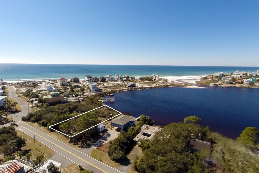 Eastern Lake is a Coastal Dune lake and rarely does a lot with direct, southwesterly views such as this come on the market. This gently sloping topography waterfront Lot, provides a high building site that will afford magnificent views beyond to the Gulf of Mexico. This lot presents a rare opportunity to begin creating your own home and memories. Fewer than 300 yards due south is the Beach Access. Kayaks, paddle boards, canoes, skiing boats, pontoon boats and rafts can be launched directly from this lot into the Eastern Lake. Life doesn't get much better than living on a Coastal Dune Lake!