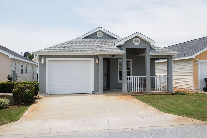 Impeccably maintained home just minutes from the beach and less than five miles from Pier Park. Brand new roof scheduled to be installed 10/9! Tucked away in the gated community of Palm Cove, this idyllic beach house features a front porch swing, tile floors throughout the main area, a master suite with walk-in closet and private en suite bath complete with double sink vanity and jetted tub with shower. Inside, vaulted ceilings give the open floor plan a spacious feel. Interior features include Sold fully furnished plus hurricane window coverings. Water heater, HVAC system, microwave and refrigerator were recently replaced. Homeowner association fees cover yard maintenance, trash disposal, security and use of the two community swimming pools.